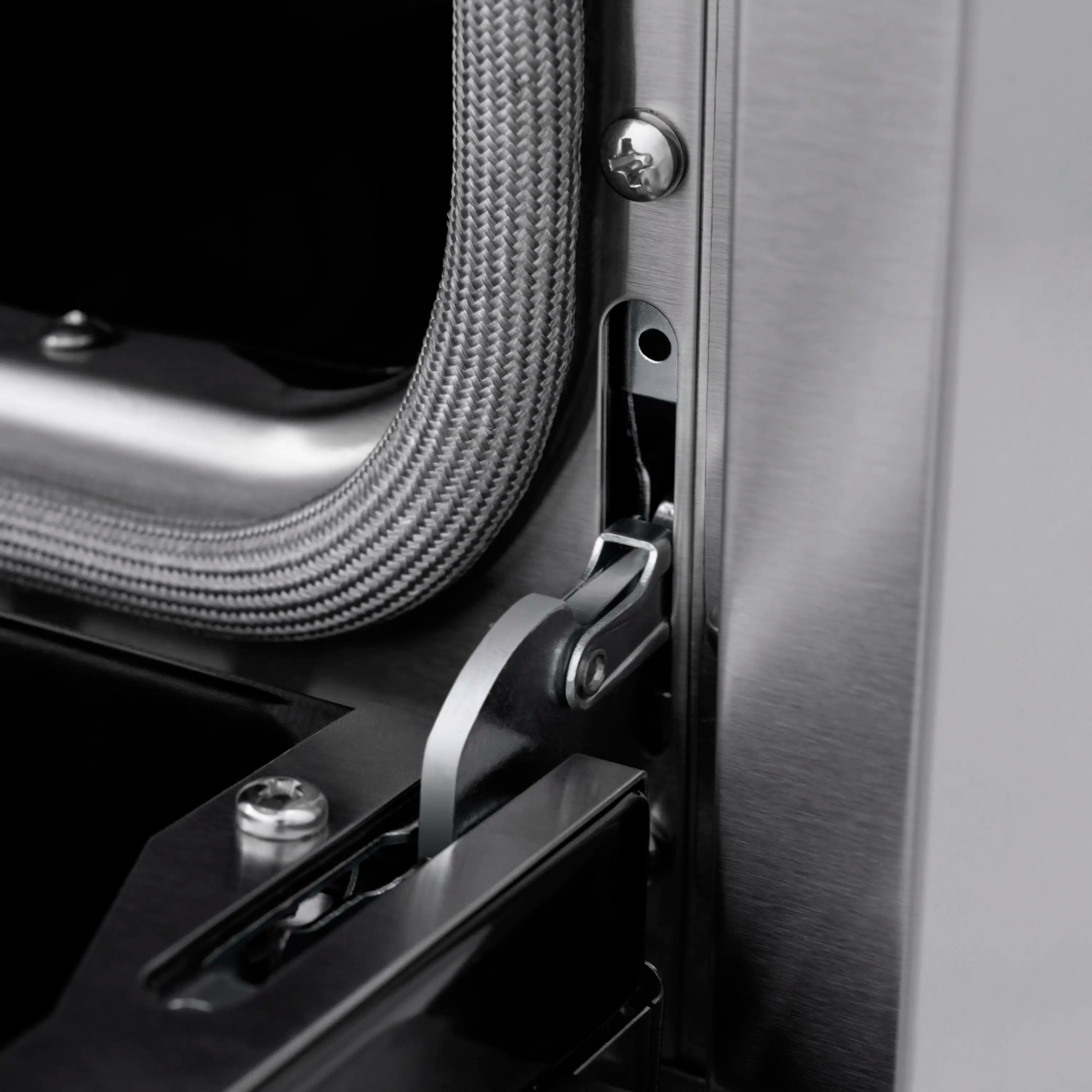 Stainless appliance side with braided hose and latch near door handle