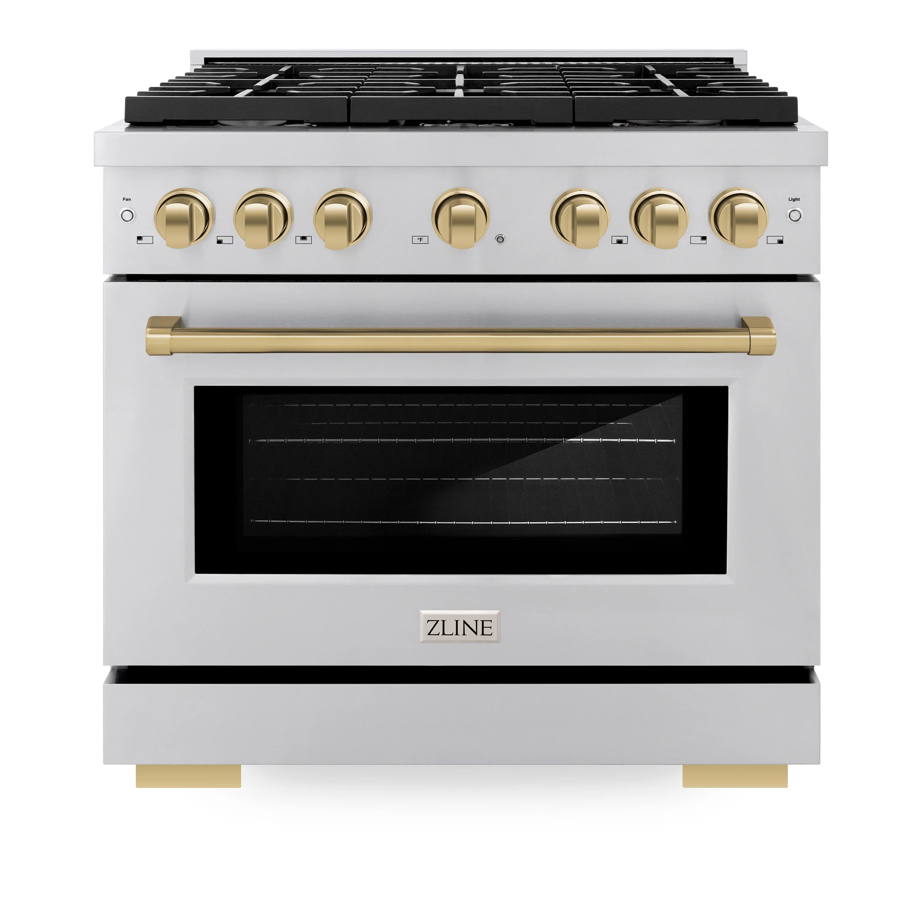 Stainless dual fuel range with black grates, champagne bronze knobs, and glass oven door