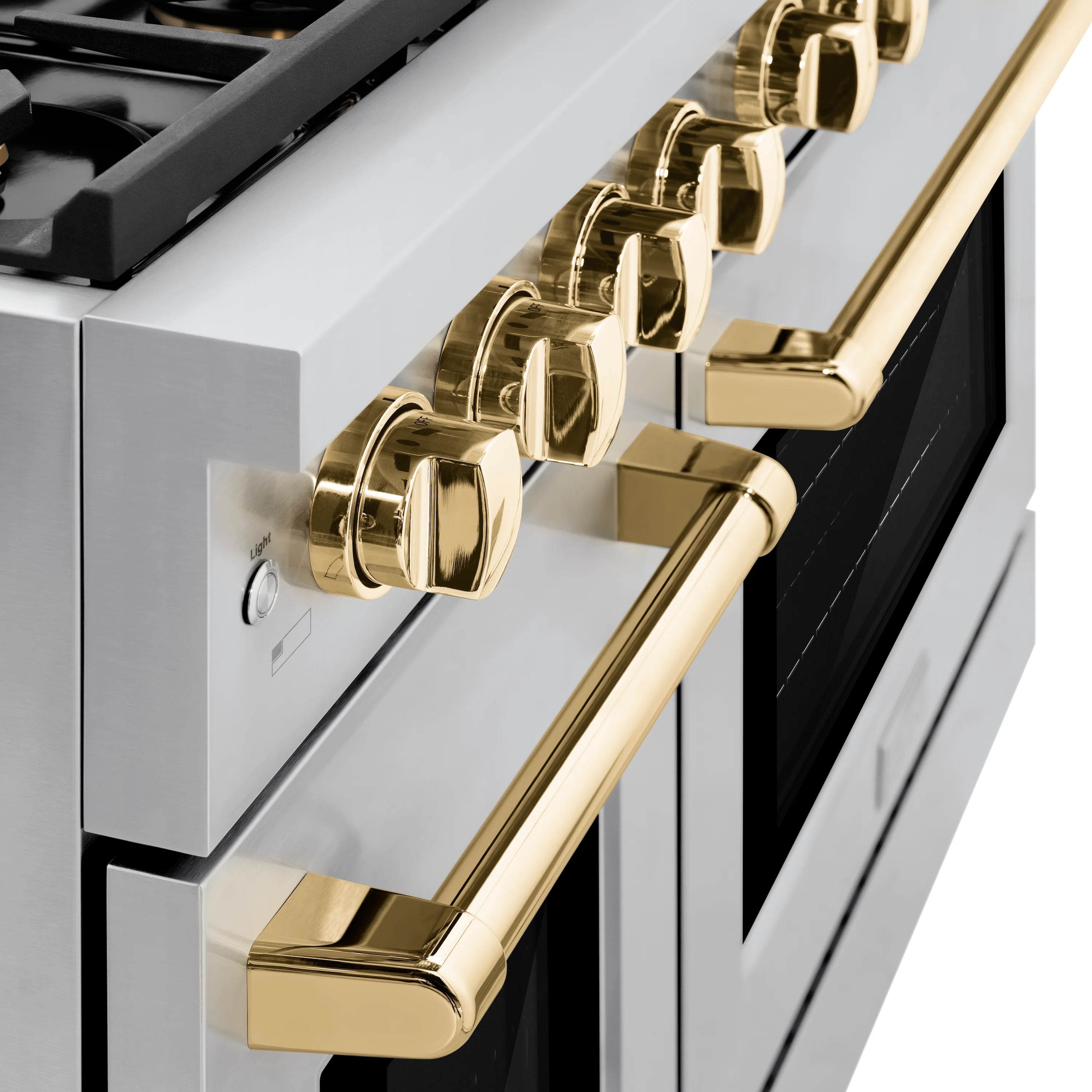 Stainless range control panel with gold knobs and gold pull handles