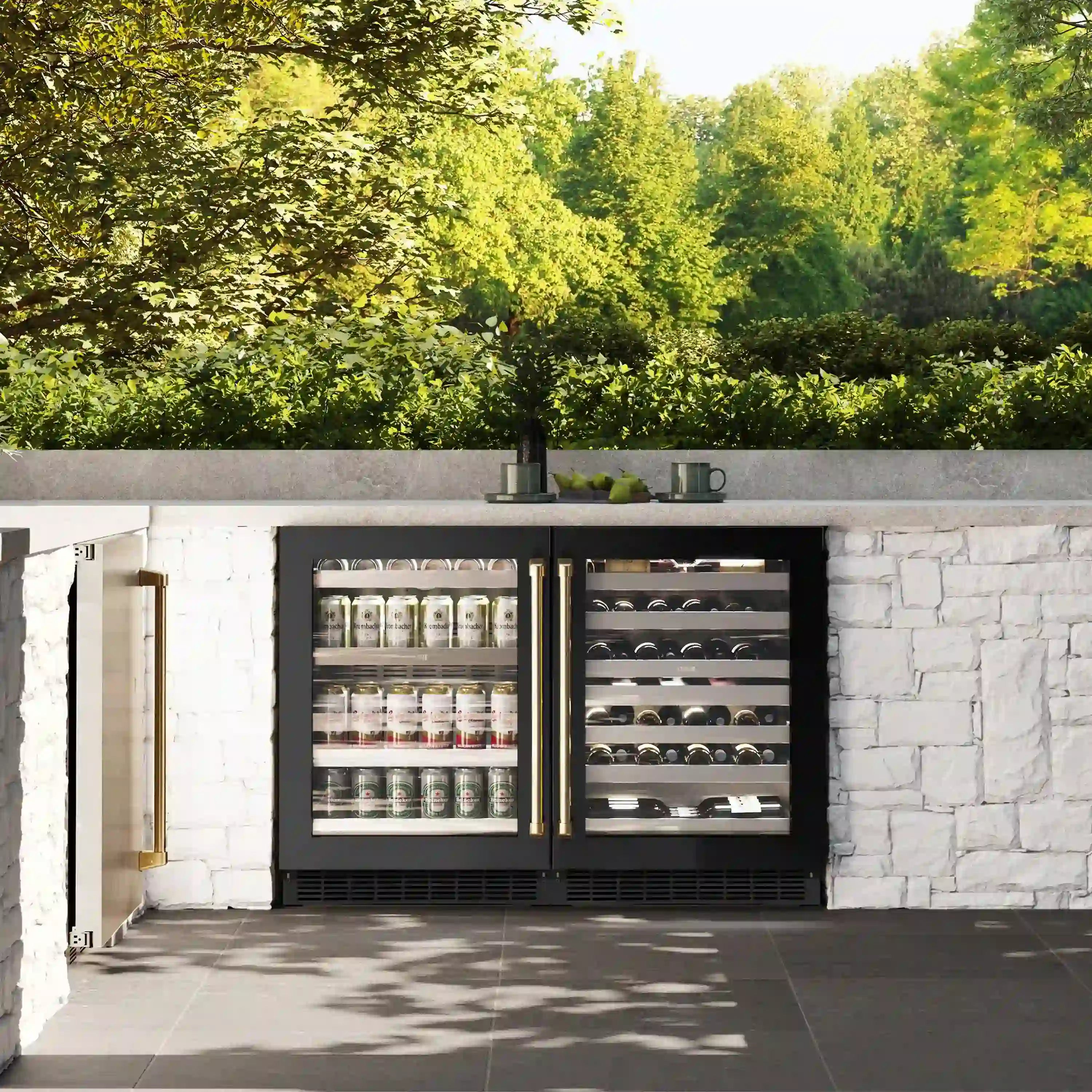 Built-in 24-inch beverage fridge set with black cabinets, gold handles, and glass doors.