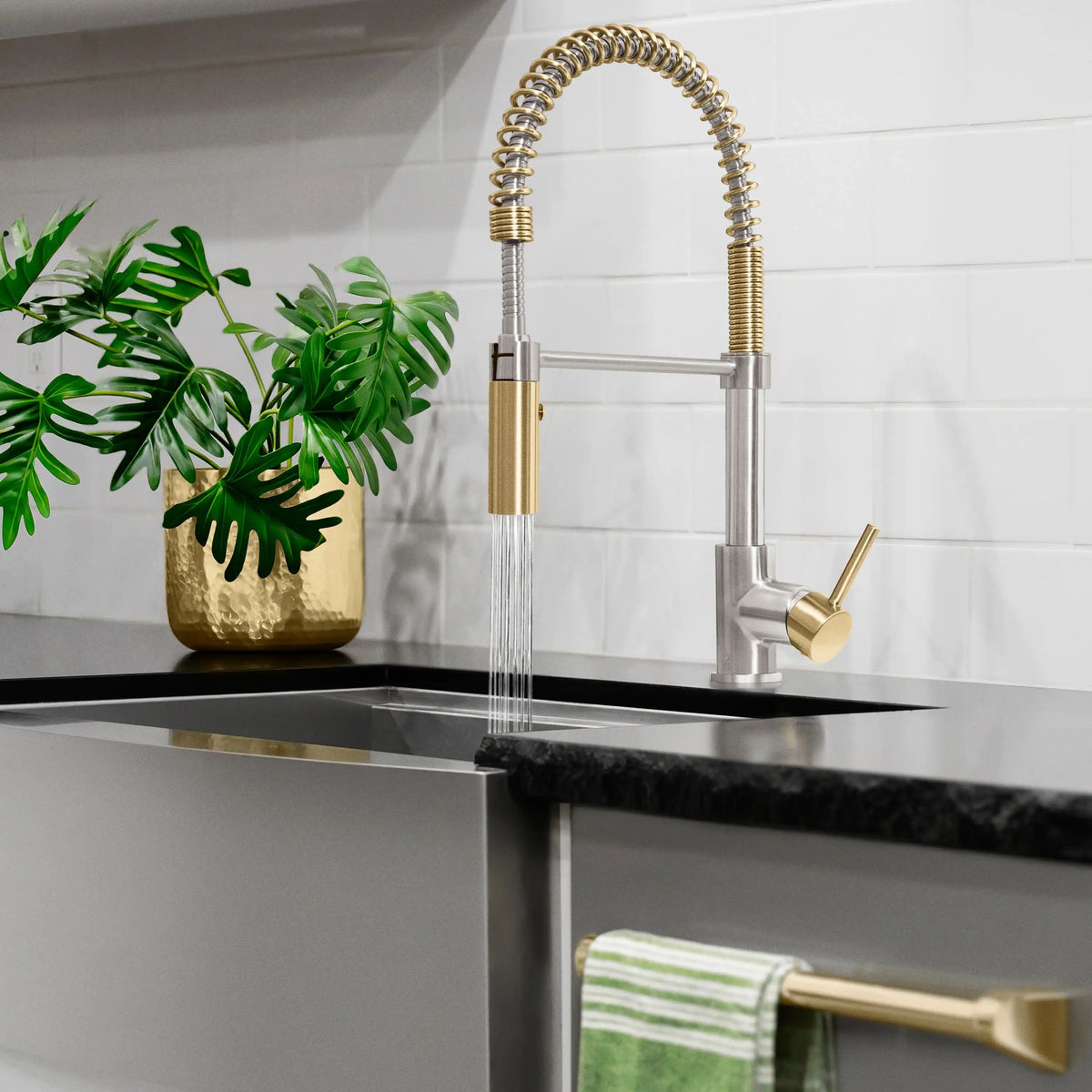 Single-handle pull-down kitchen faucet with brushed nickel neck and champagne bronze accents