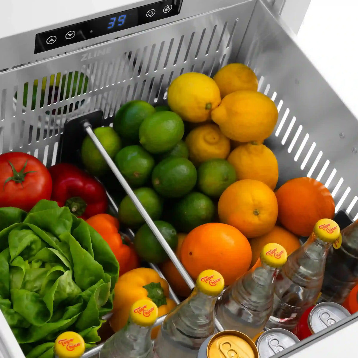 Refrigerator drawer filled with produce and canned drinks; digital temperature display