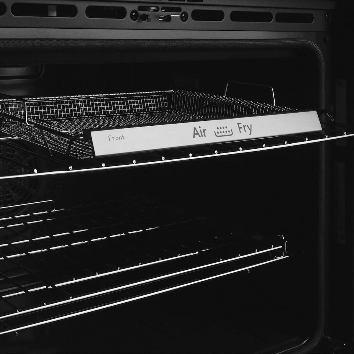 Double wall oven with wire rack and tray, control bar labeled Air Fry