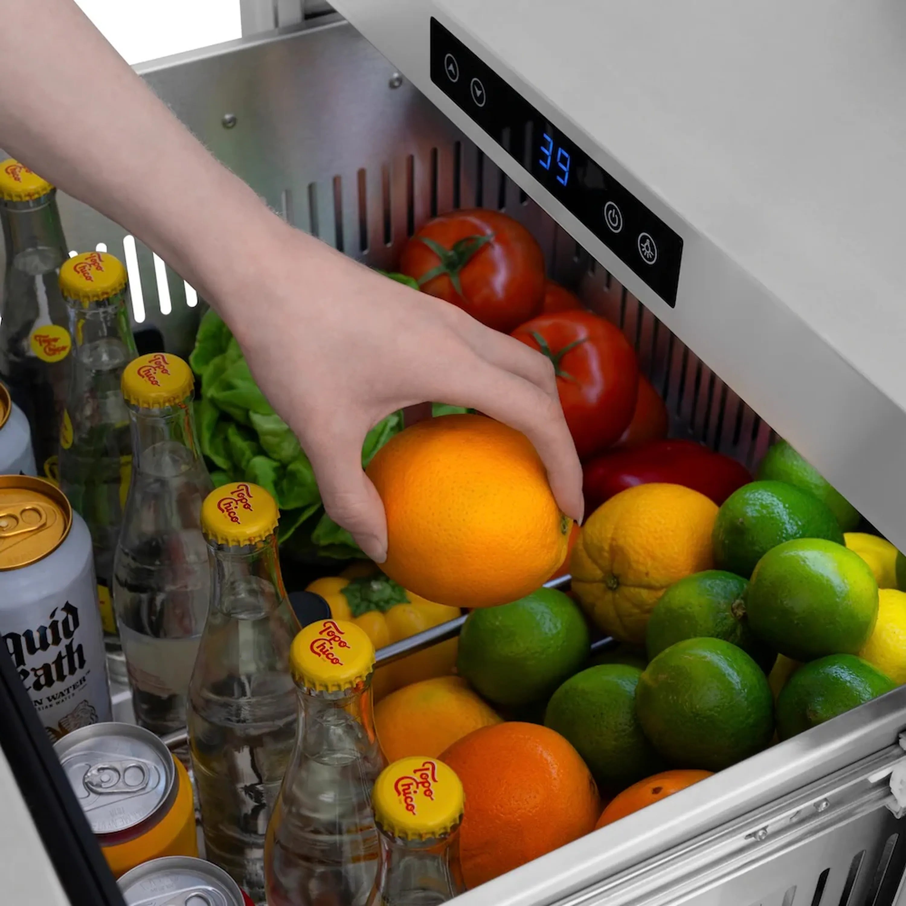 Black stainless refrigerator drawer open, showing touch control panel and produce inside