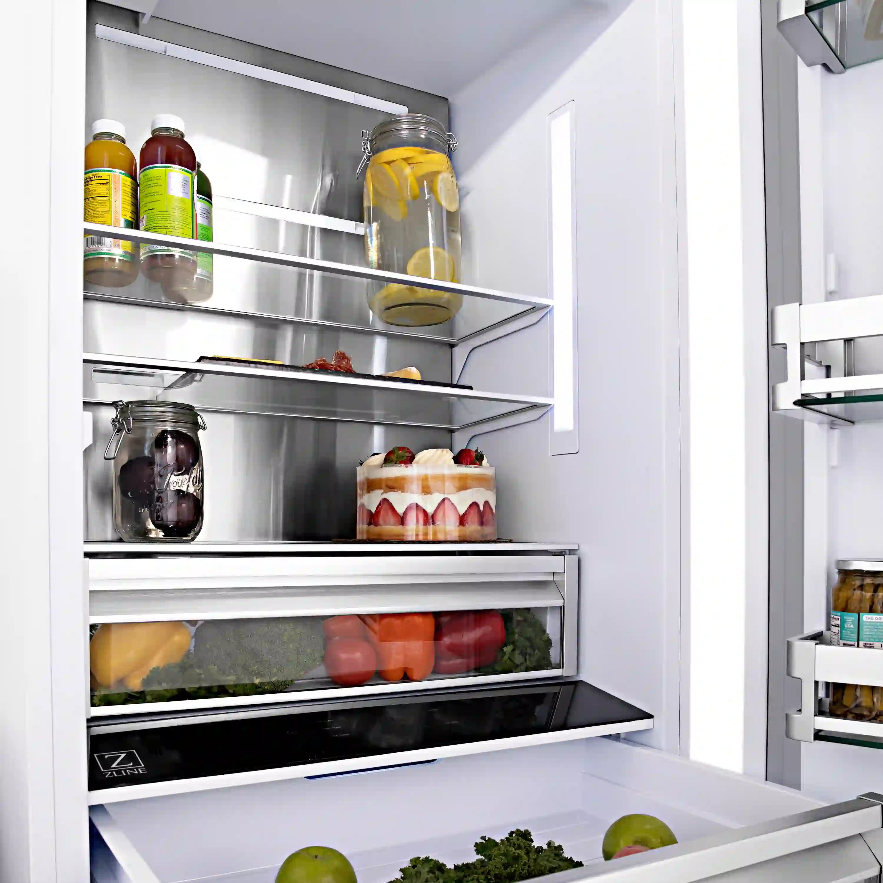 Built-in refrigerator interior with glass shelves and door storage in the freezer section