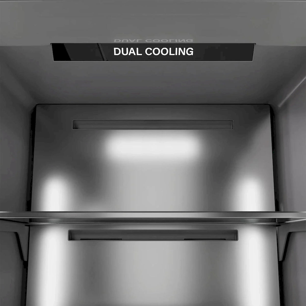 Panel-ready refrigerator/freezer interior with dual cooling vent at top