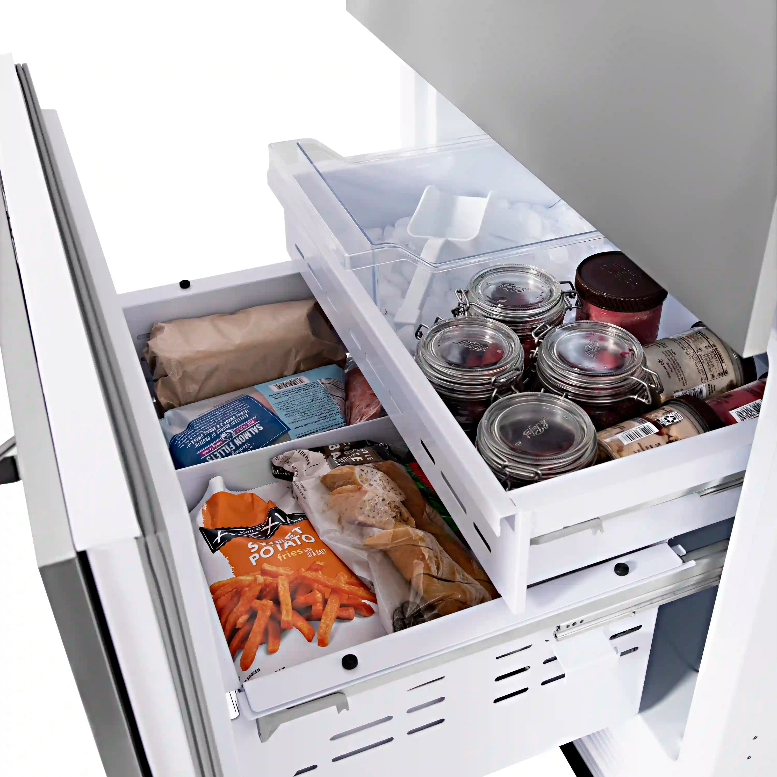Open freezer drawer with clear bin and jars plus packaged food