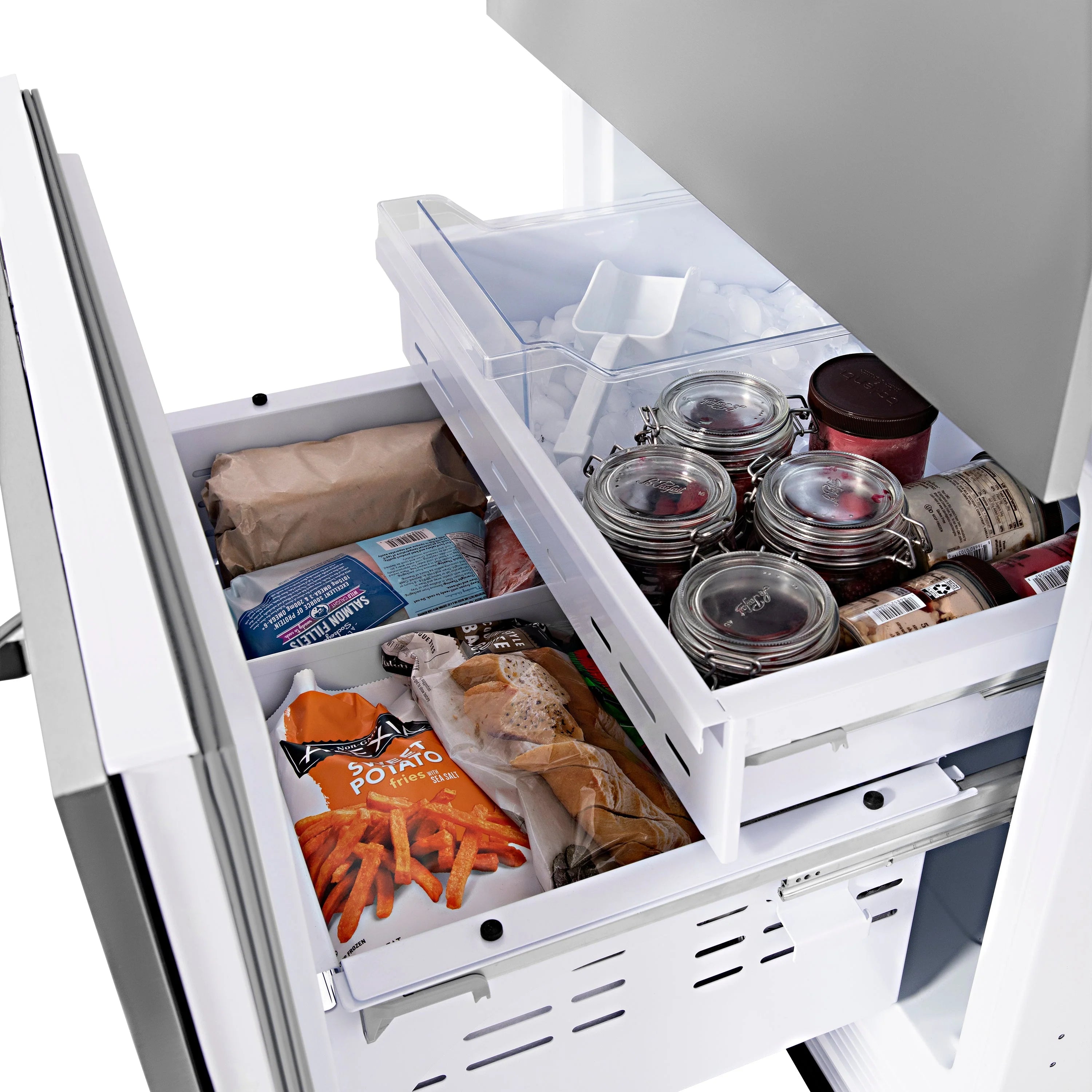 Refrigerator freezer drawer with clear bins holding packaged food and jars