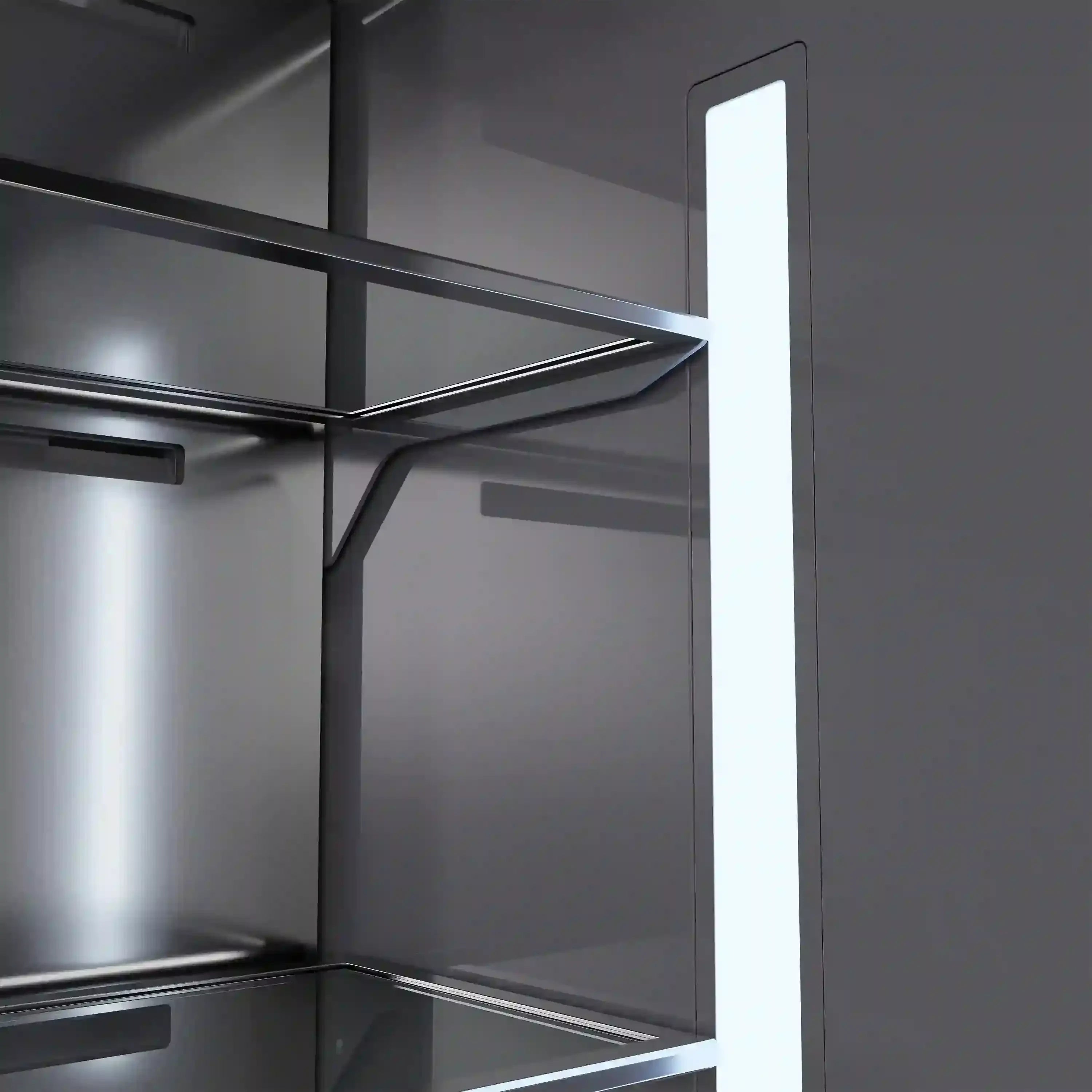 Bottom freezer interior with wire shelves and bright vertical interior light.