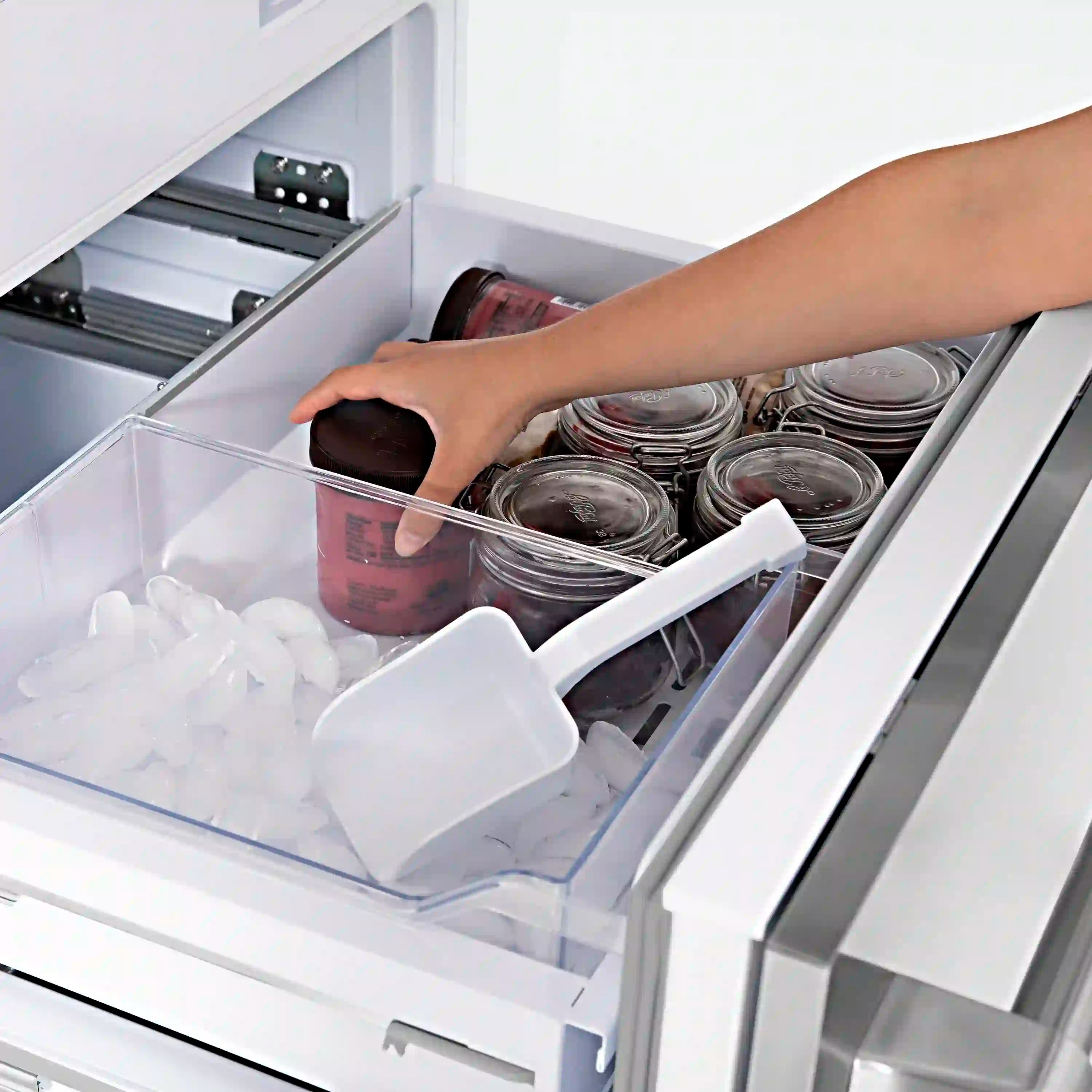 Bottom freezer drawer with clear bin, ice, and glass jars