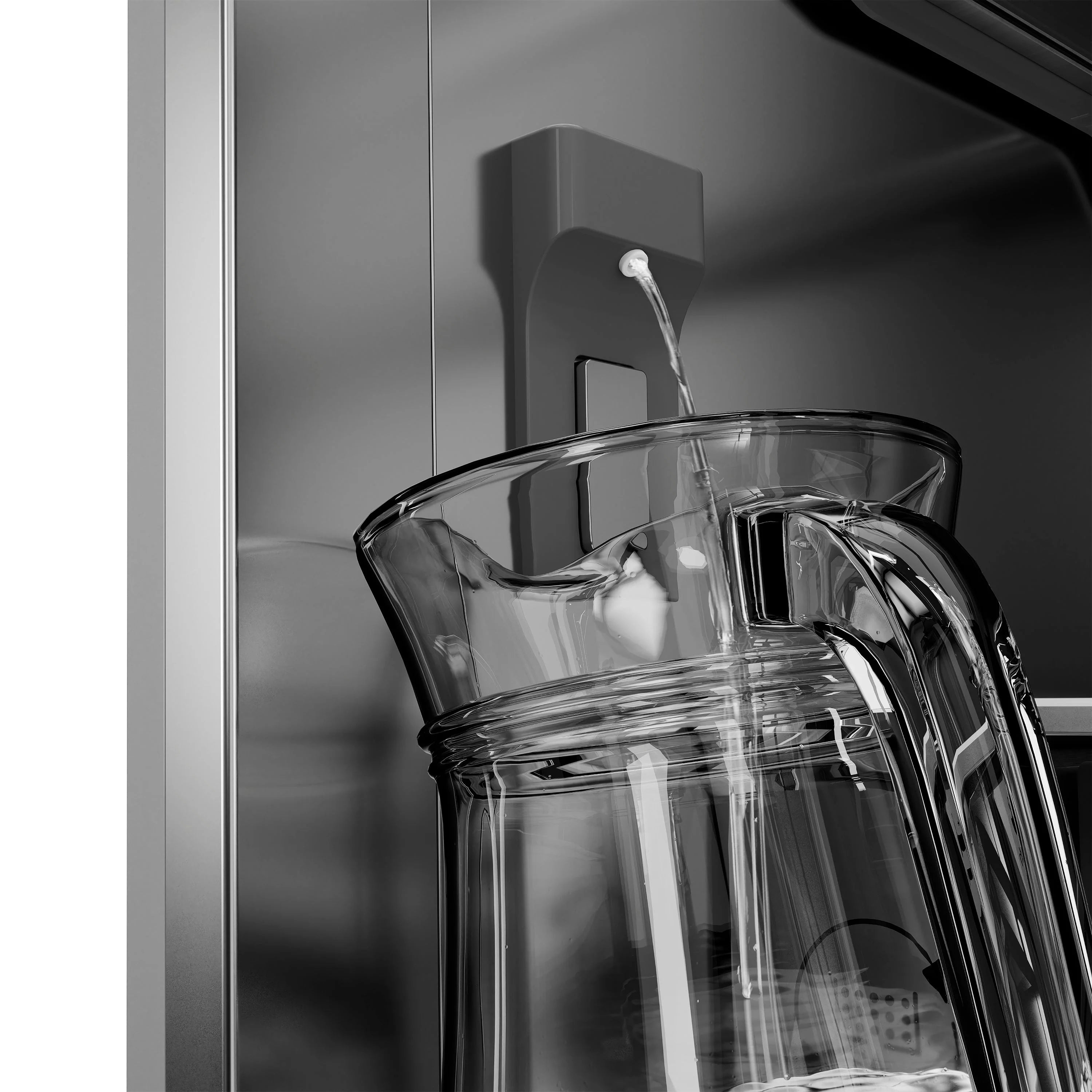 Water dispenser area with clear glass pitcher and stainless refrigerator door