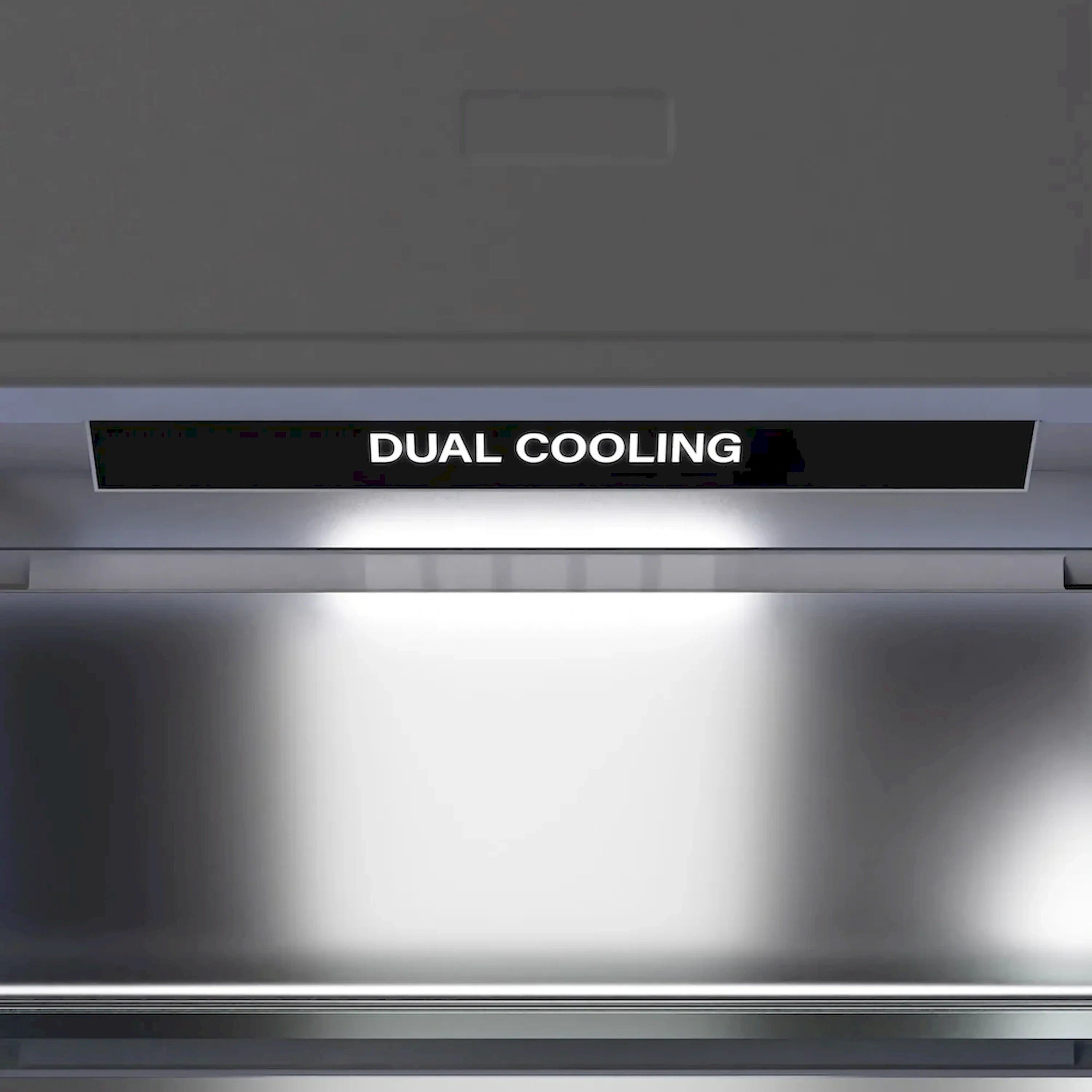 Refrigerator interior front vent with label reading “DUAL COOLING”