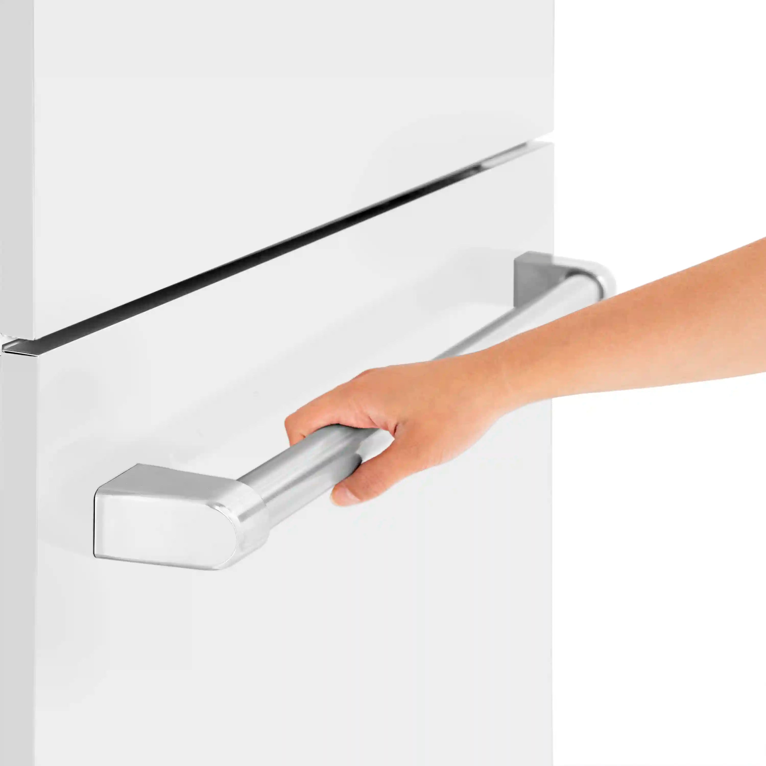 Ice dispenser lever on white refrigerator door, with hand operating the handle