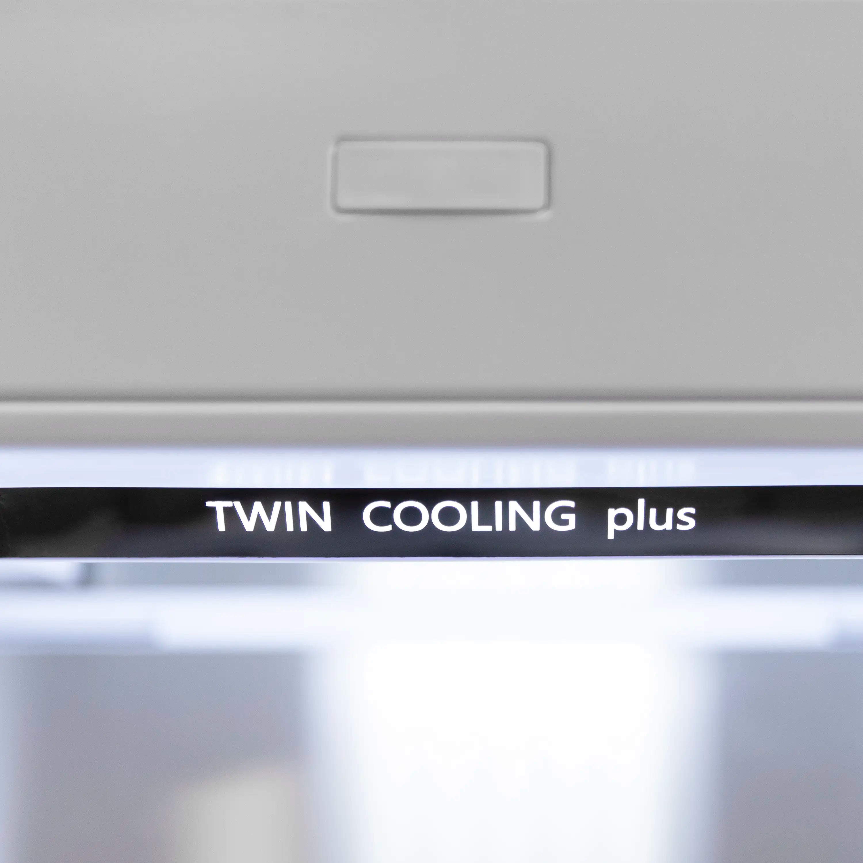 Twin Cooling plus label on bottom freezer refrigerator front control area