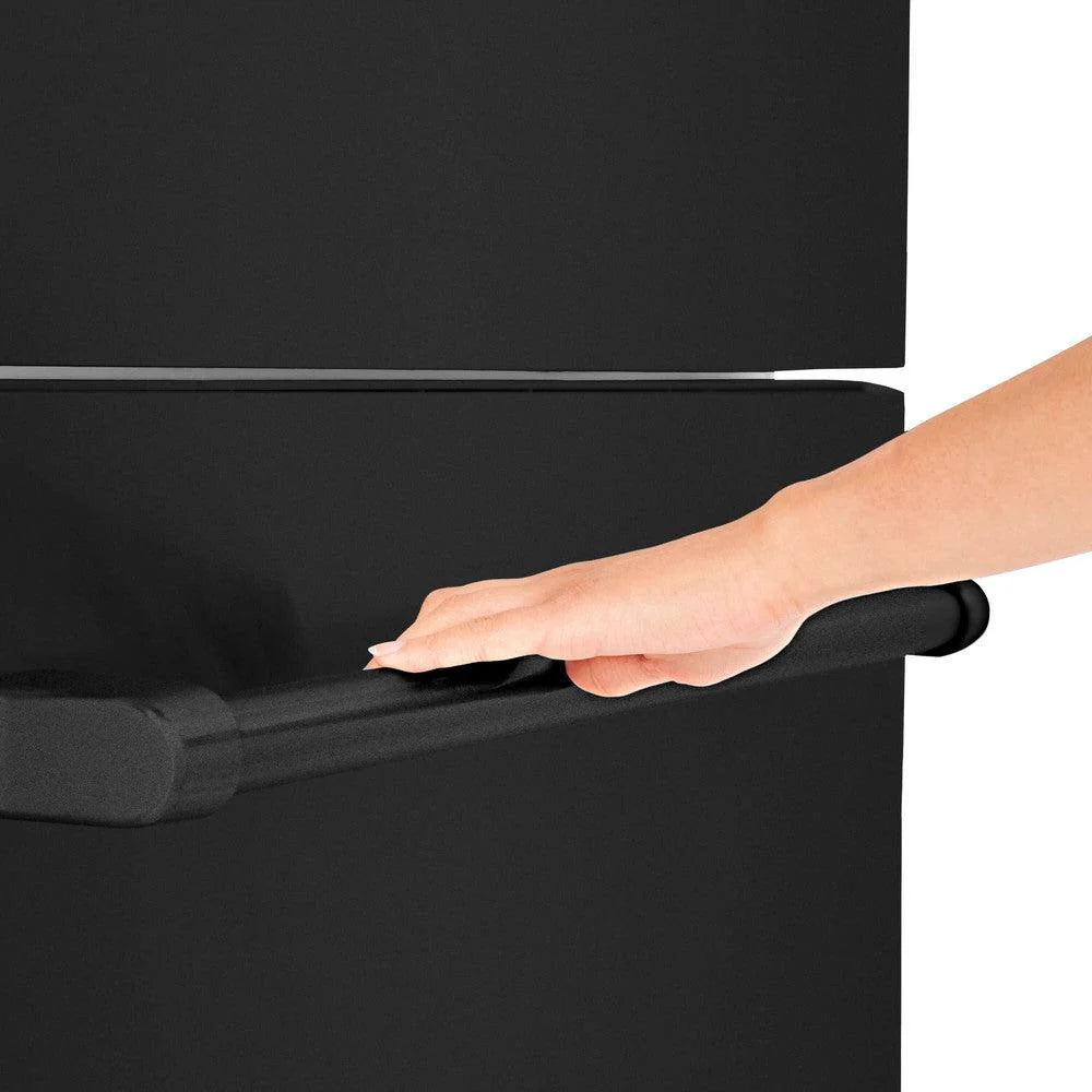 Black bar handle on a dark refrigerator door, hand pulling the handle