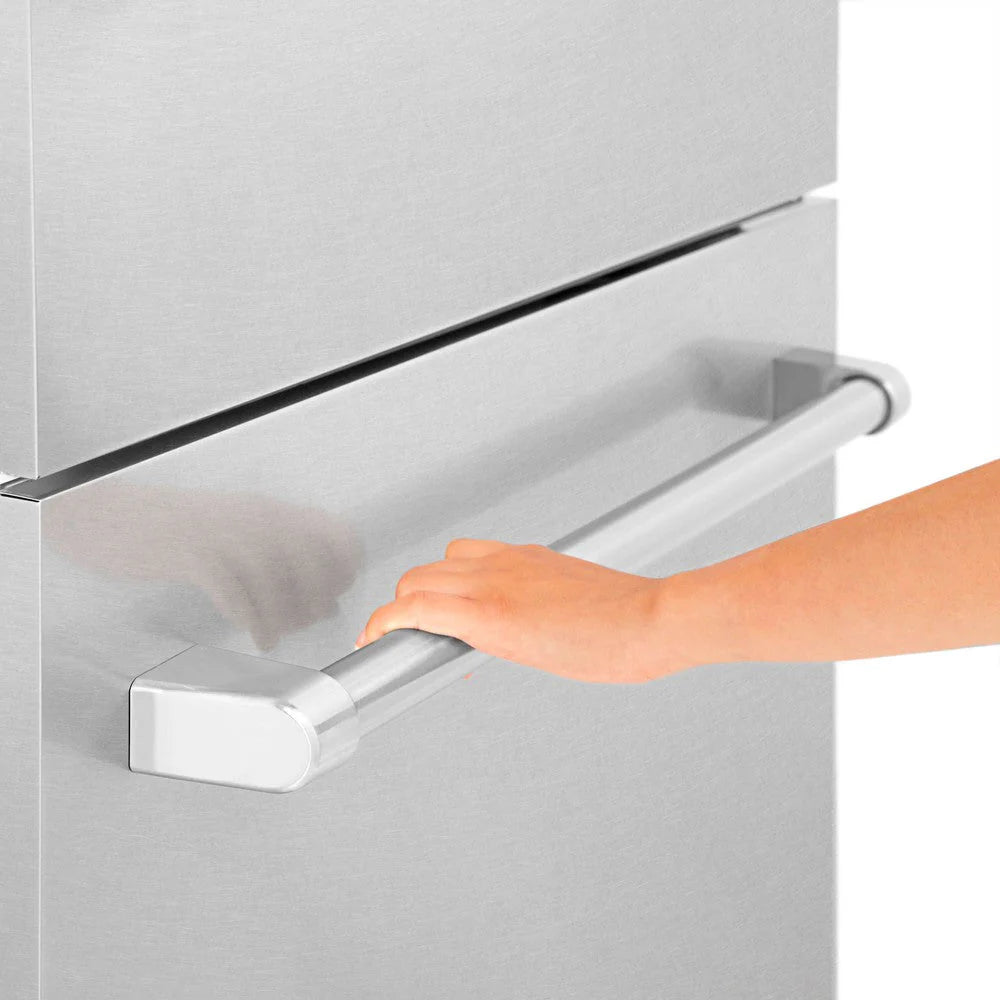Hand pulling a stainless steel refrigerator panel handle bar on built-in door