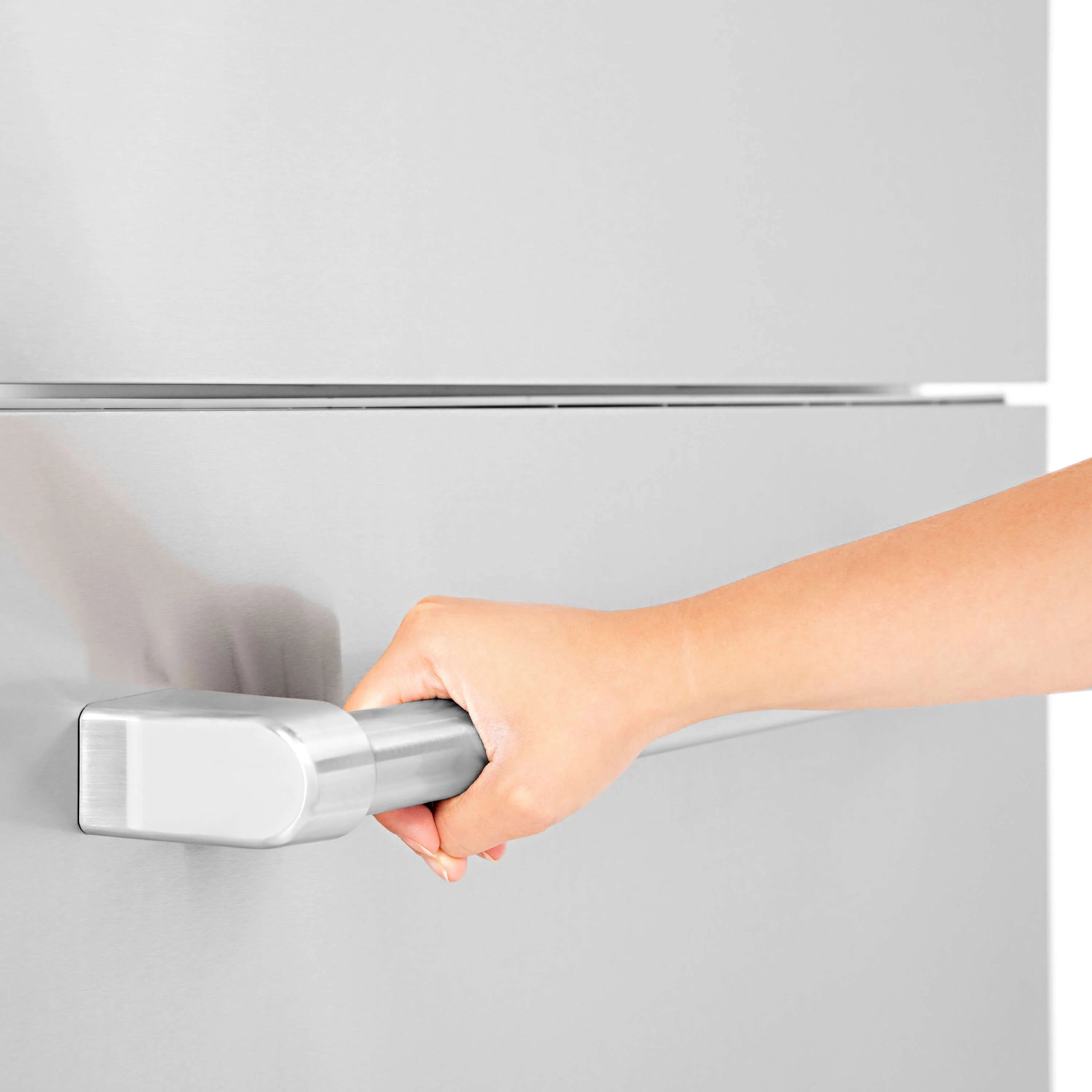 Stainless steel refrigerator handle with rectangular grip, held by a hand