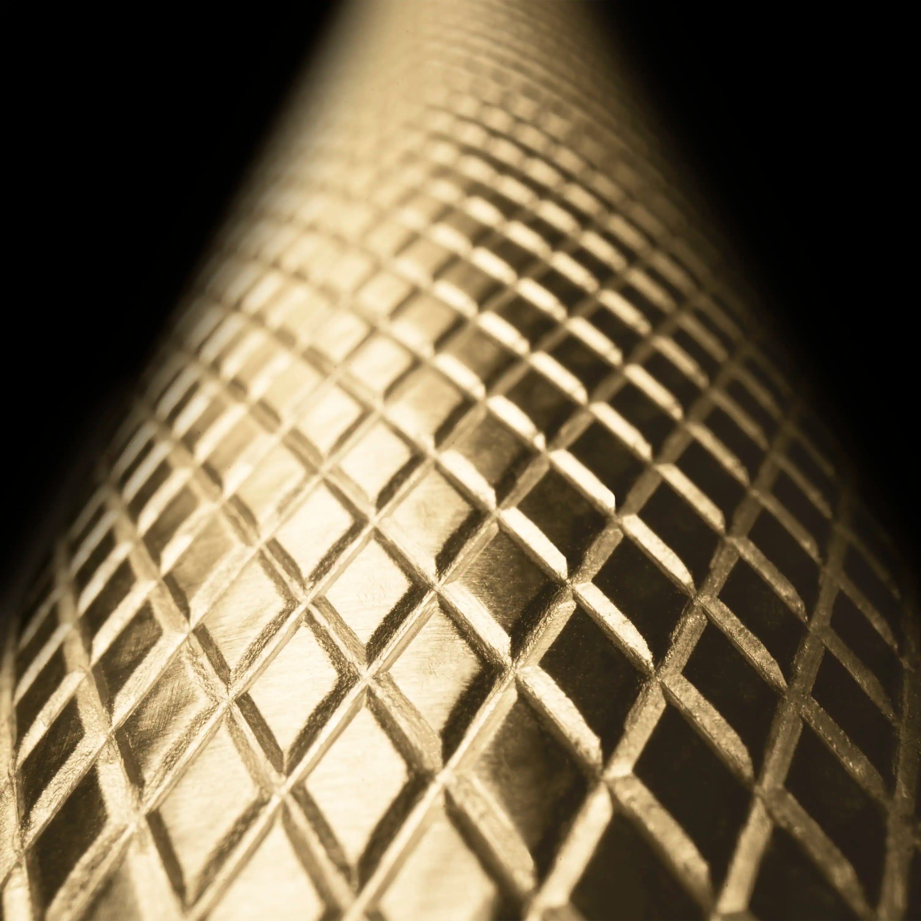 Close-up of champagne bronze metal grid texture on the range interior