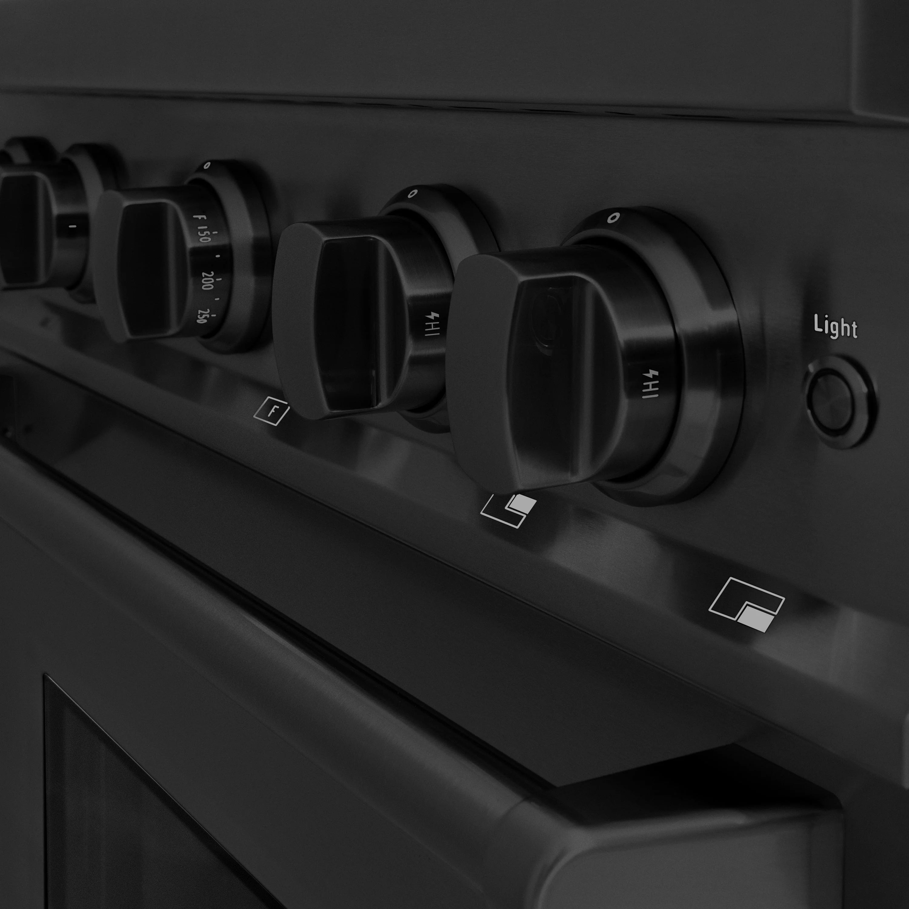 Black gas range control panel with multiple knobs and 'Light' label