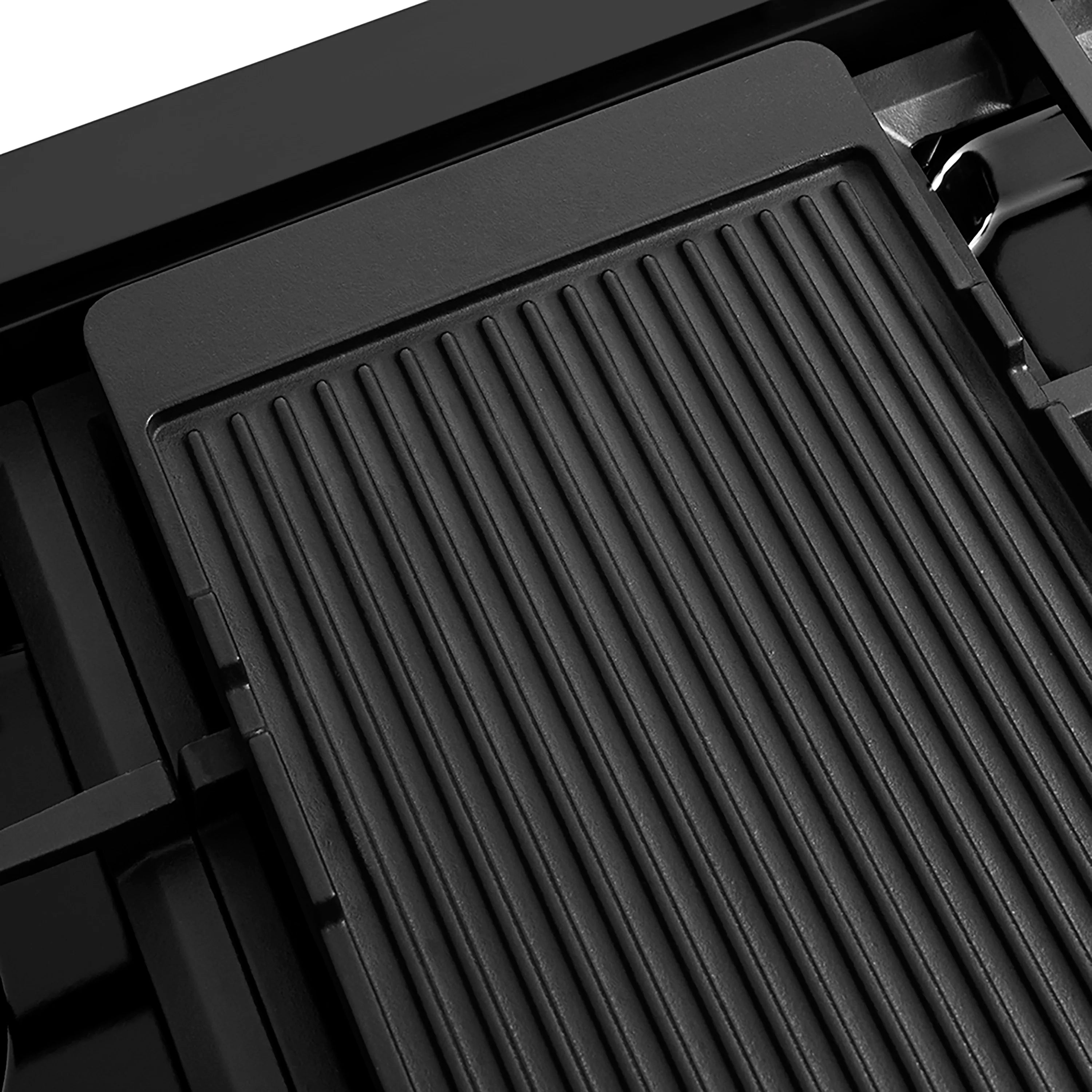 Reversible griddle insert on black gas rangetop cooktop