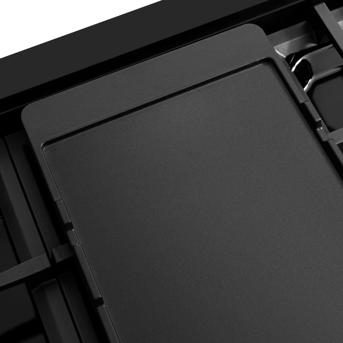 Flat dark cooktop insert cover panel with recessed edges