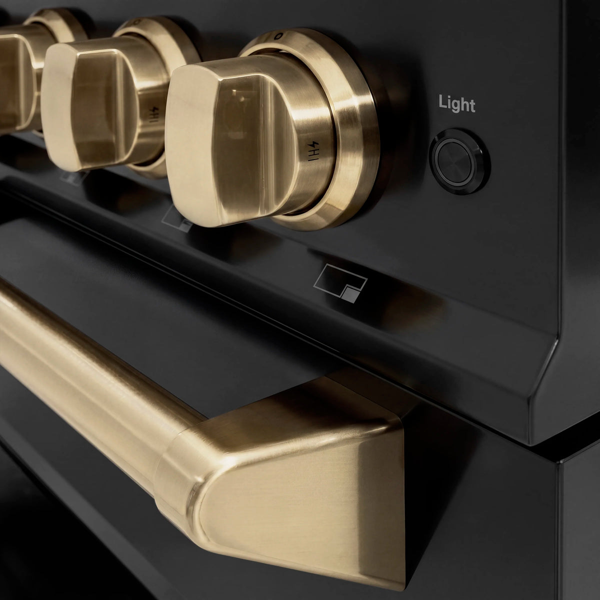 Black control panel with bronze knobs and Light button