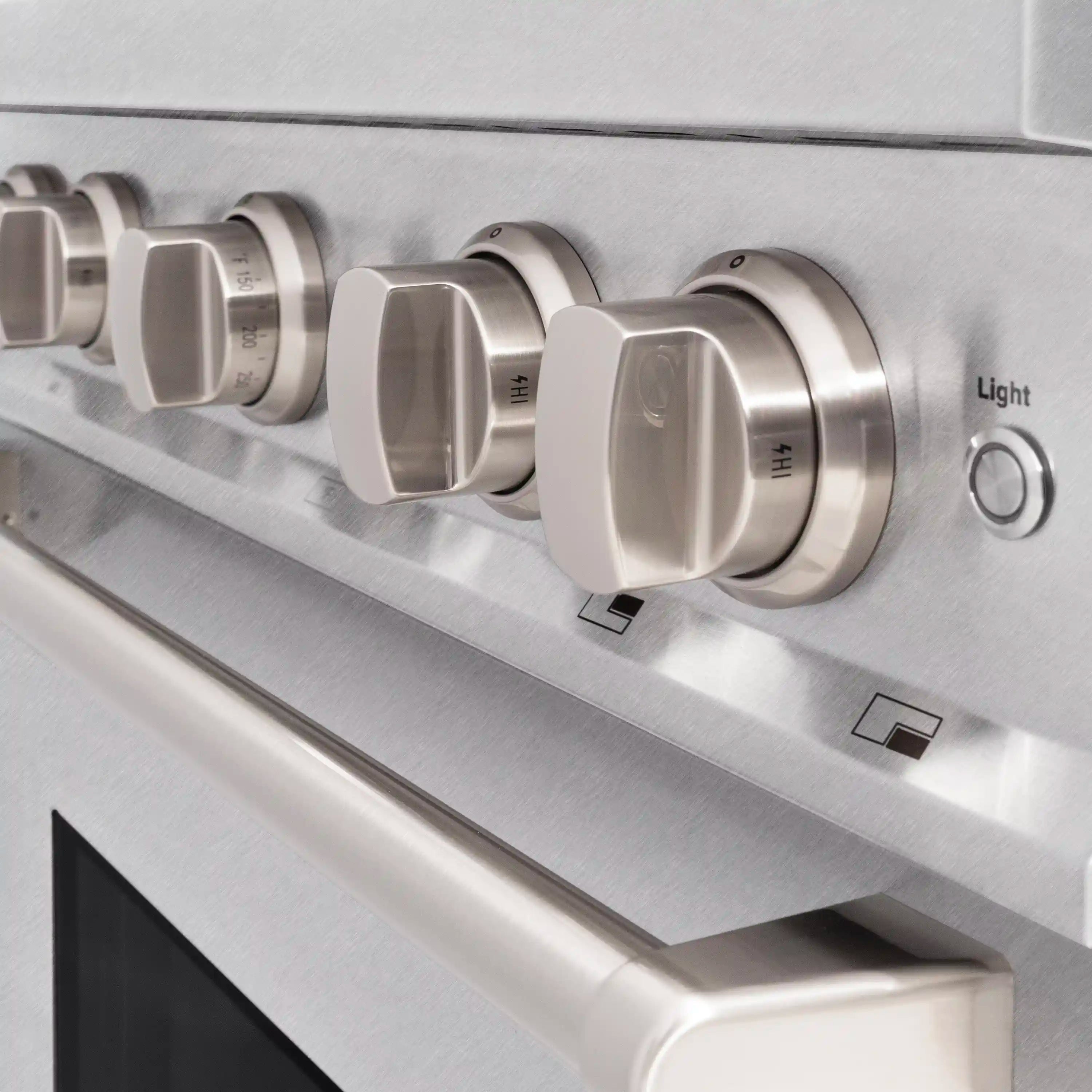 Stainless steel control knobs and cooktop panel on gas range