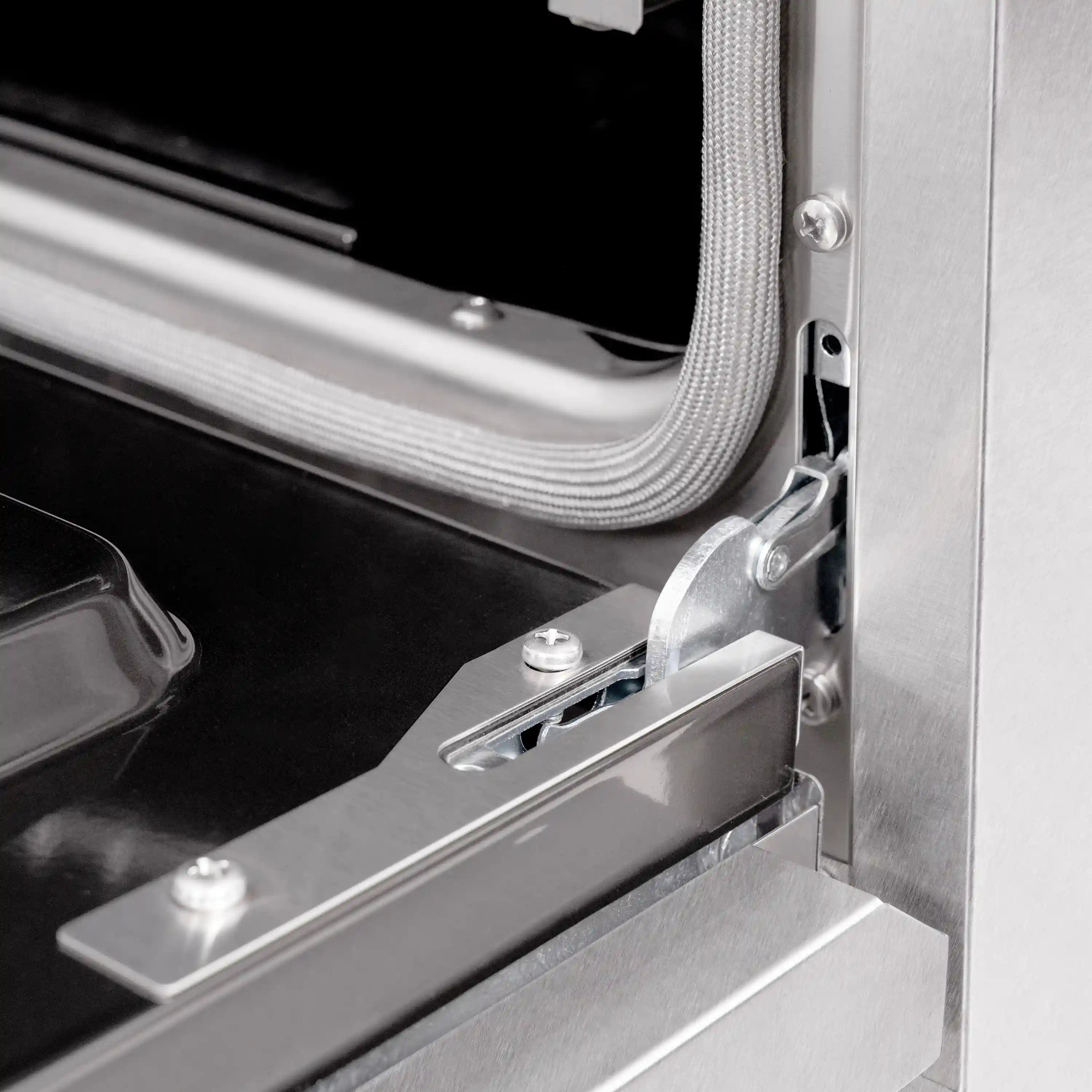 Gas oven door hinge and latch hardware in brushed stainless steel