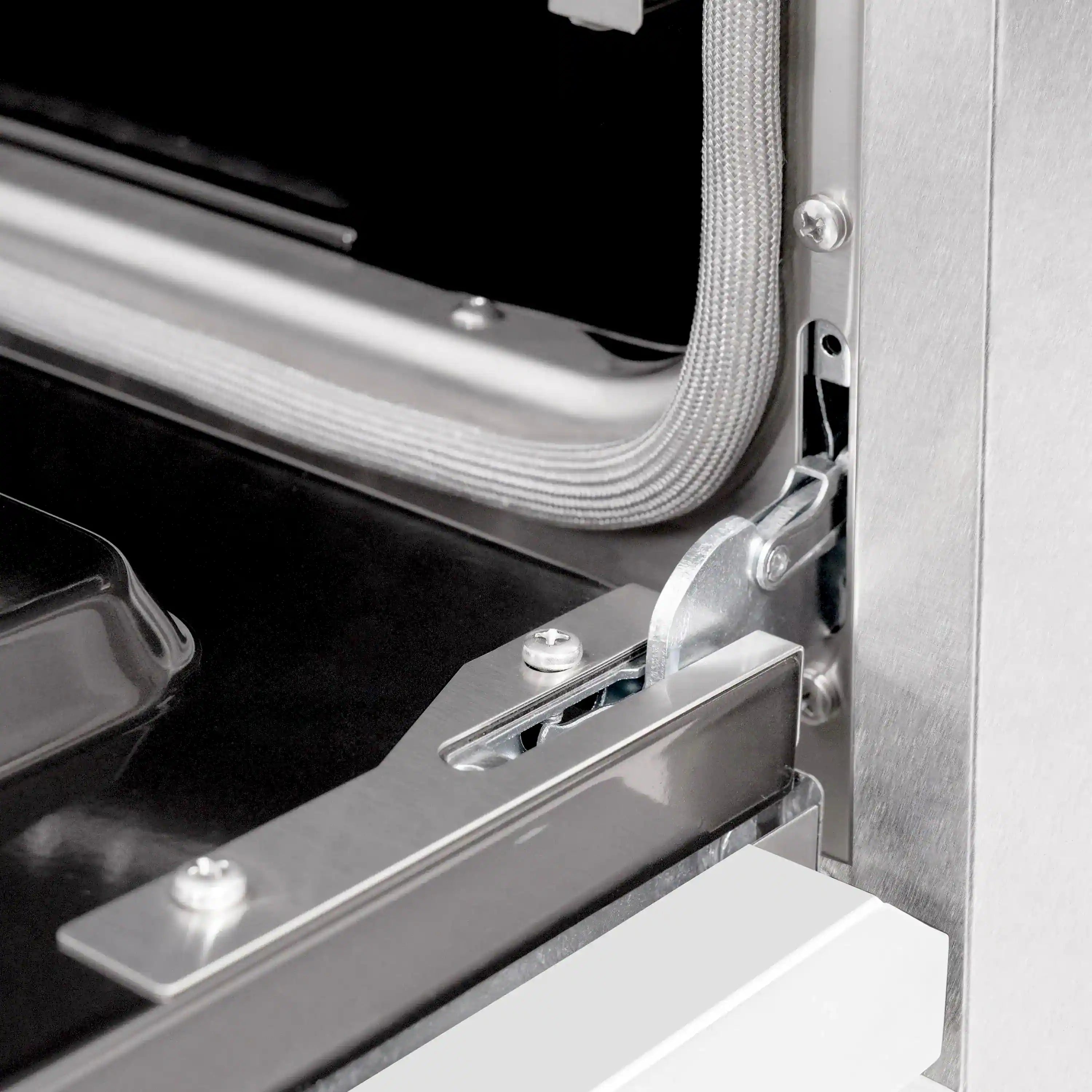 Dual fuel range oven door hinge and latch mechanism detail
