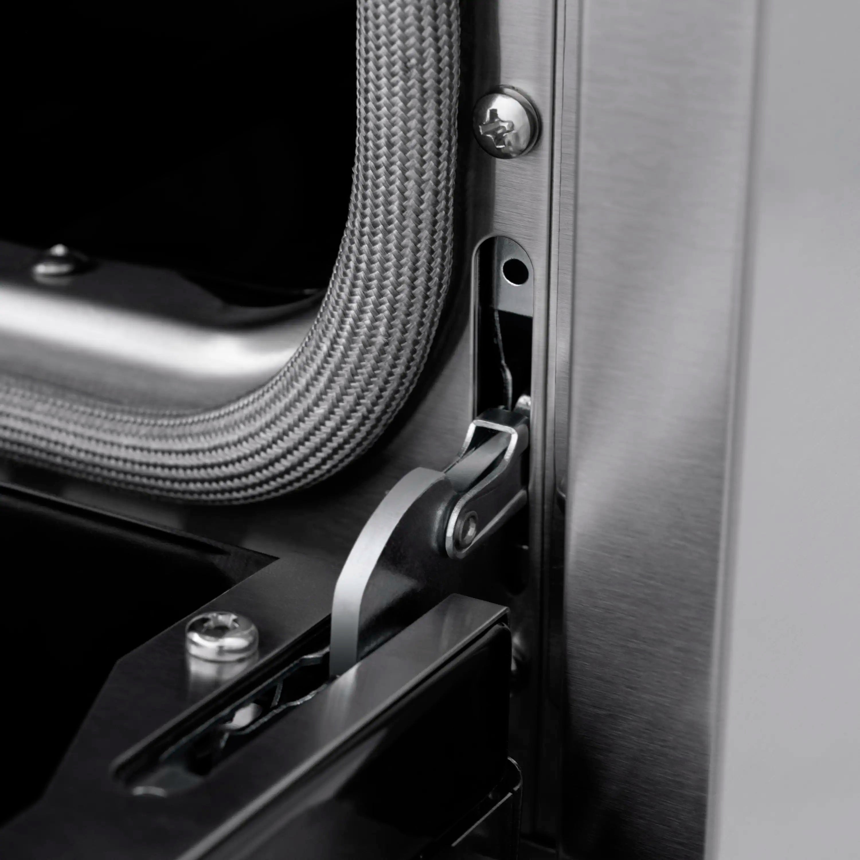 Dual-fuel range side panel with metal connector and braided gas line