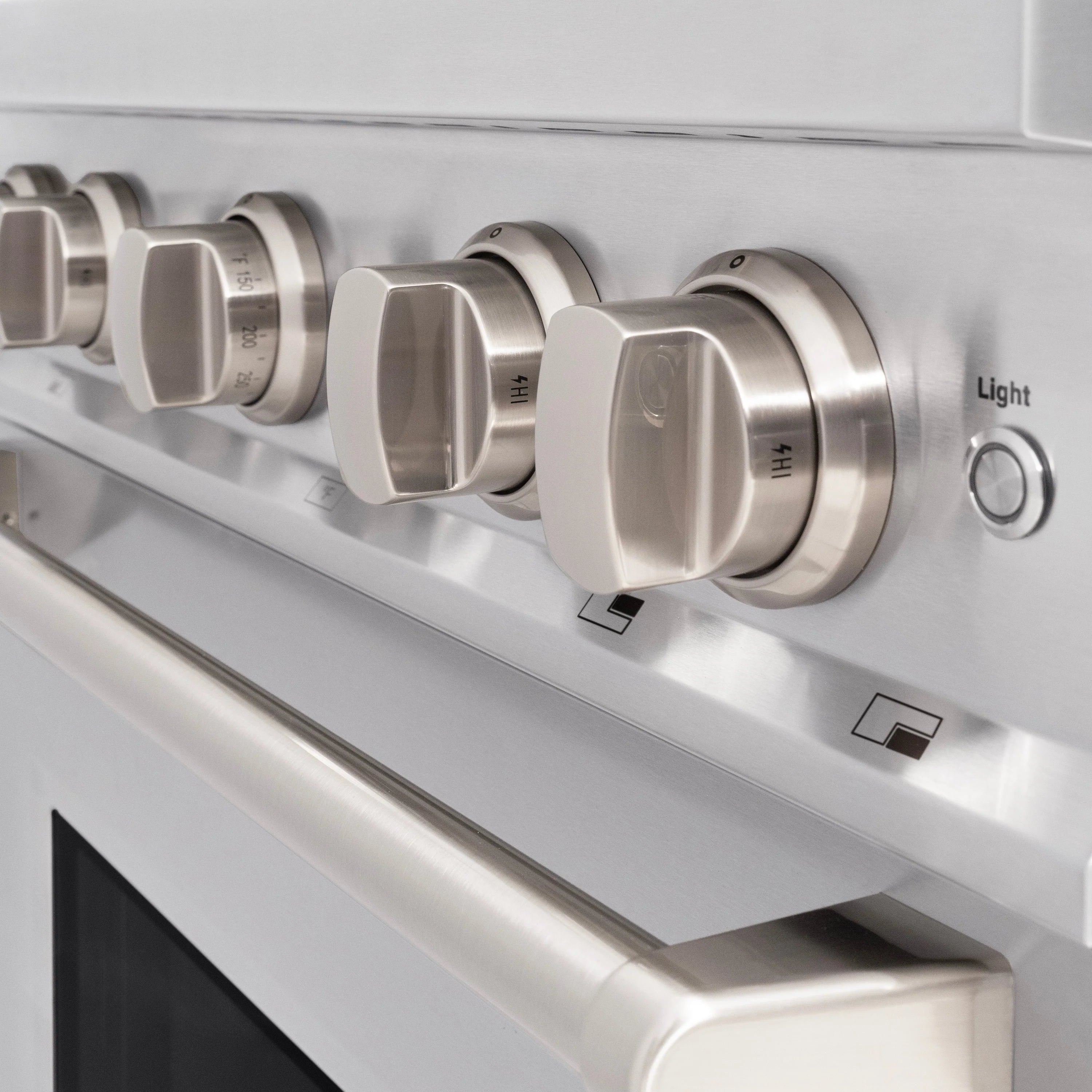Stainless steel gas range control panel with 5 knobs and indicator label