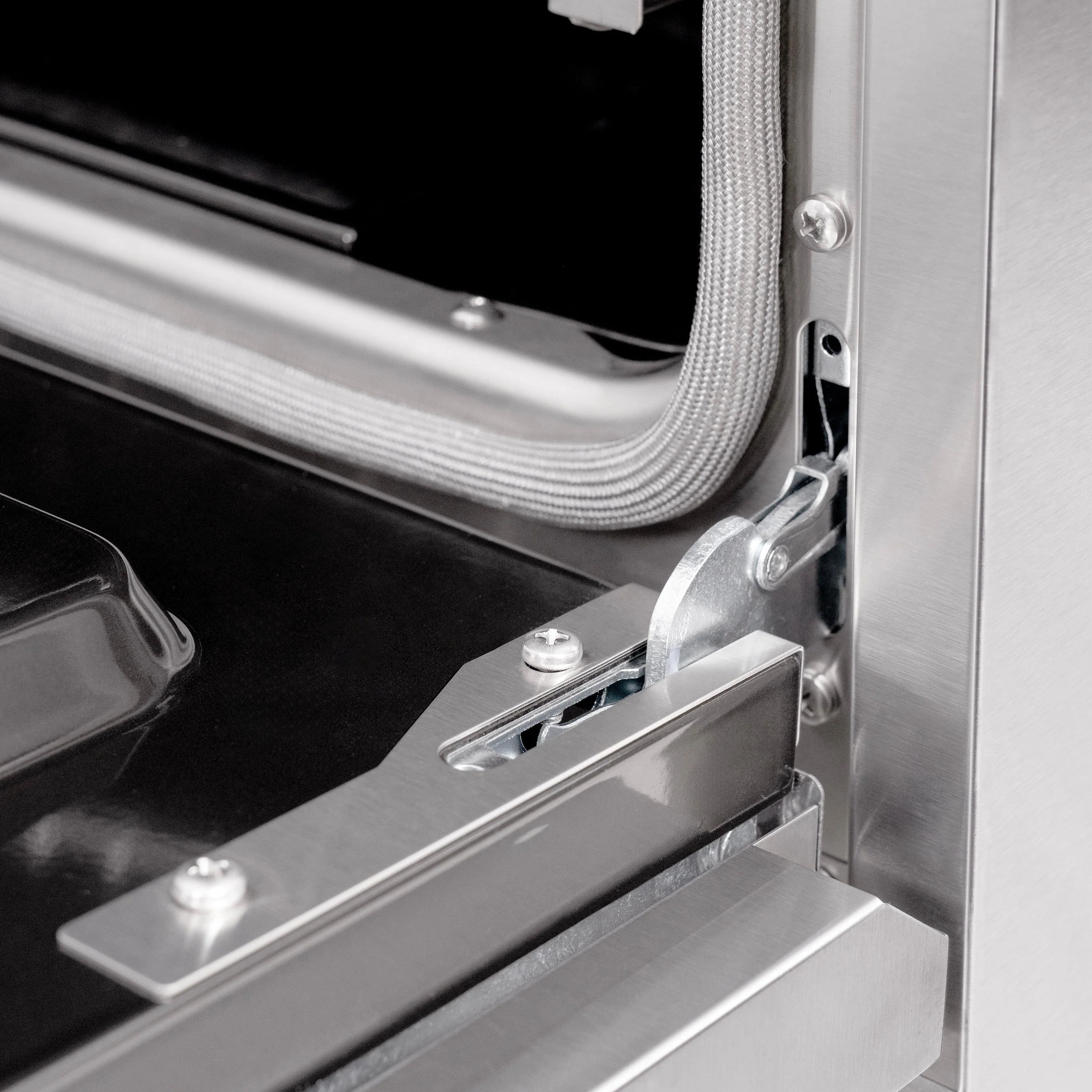 Stainless steel oven side rail and vented drawer trim with mounting bracket