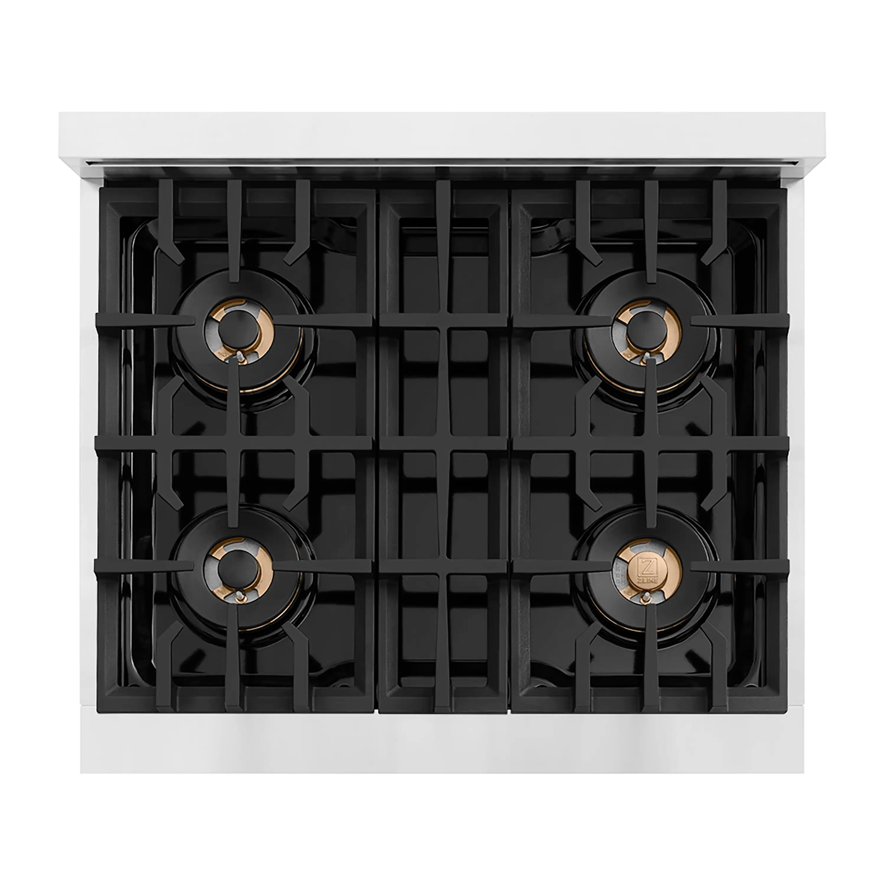Top view of a four-burner gas cooktop with black grates and bronze centers