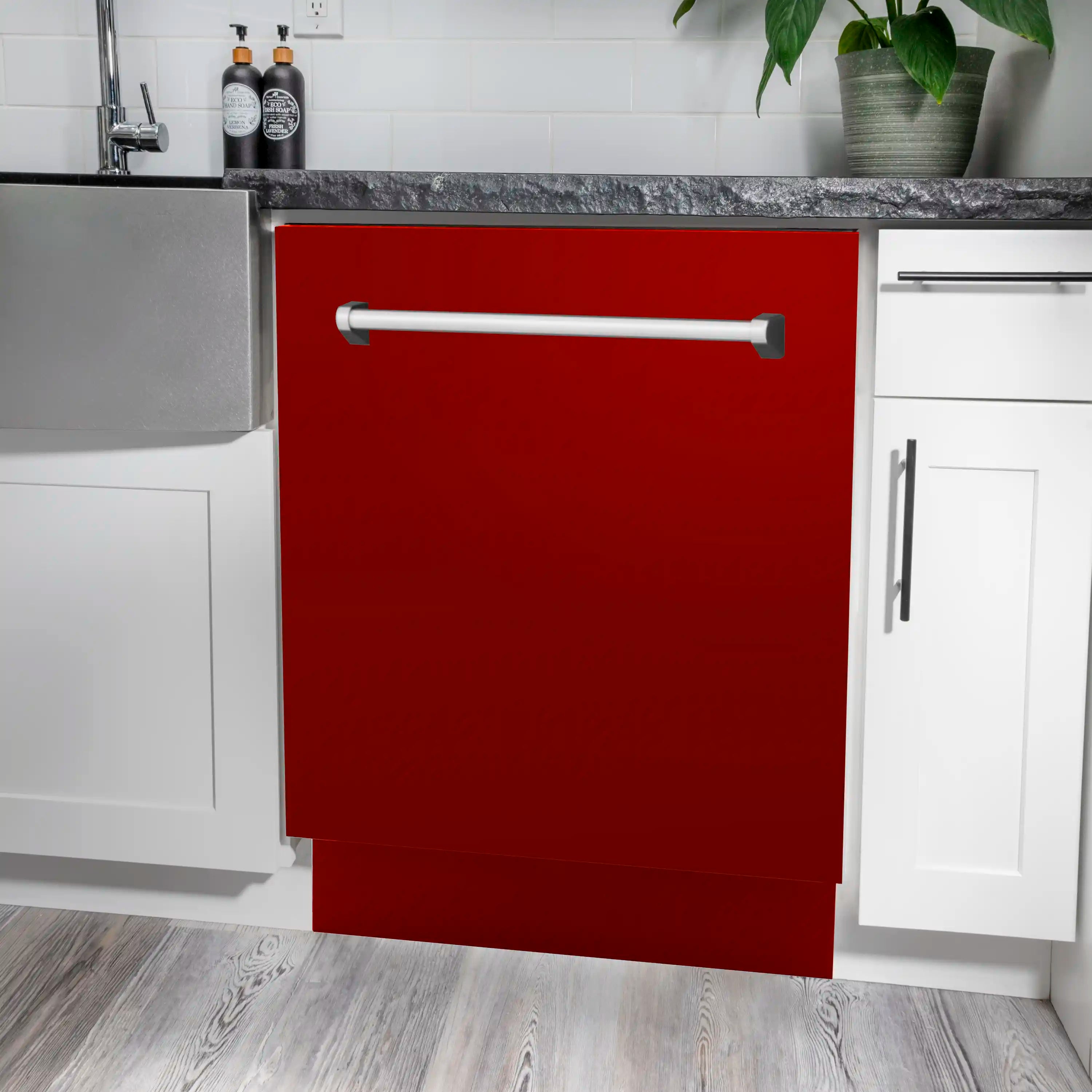 Red gloss tall dishwasher with stainless handle, installed between cabinets
