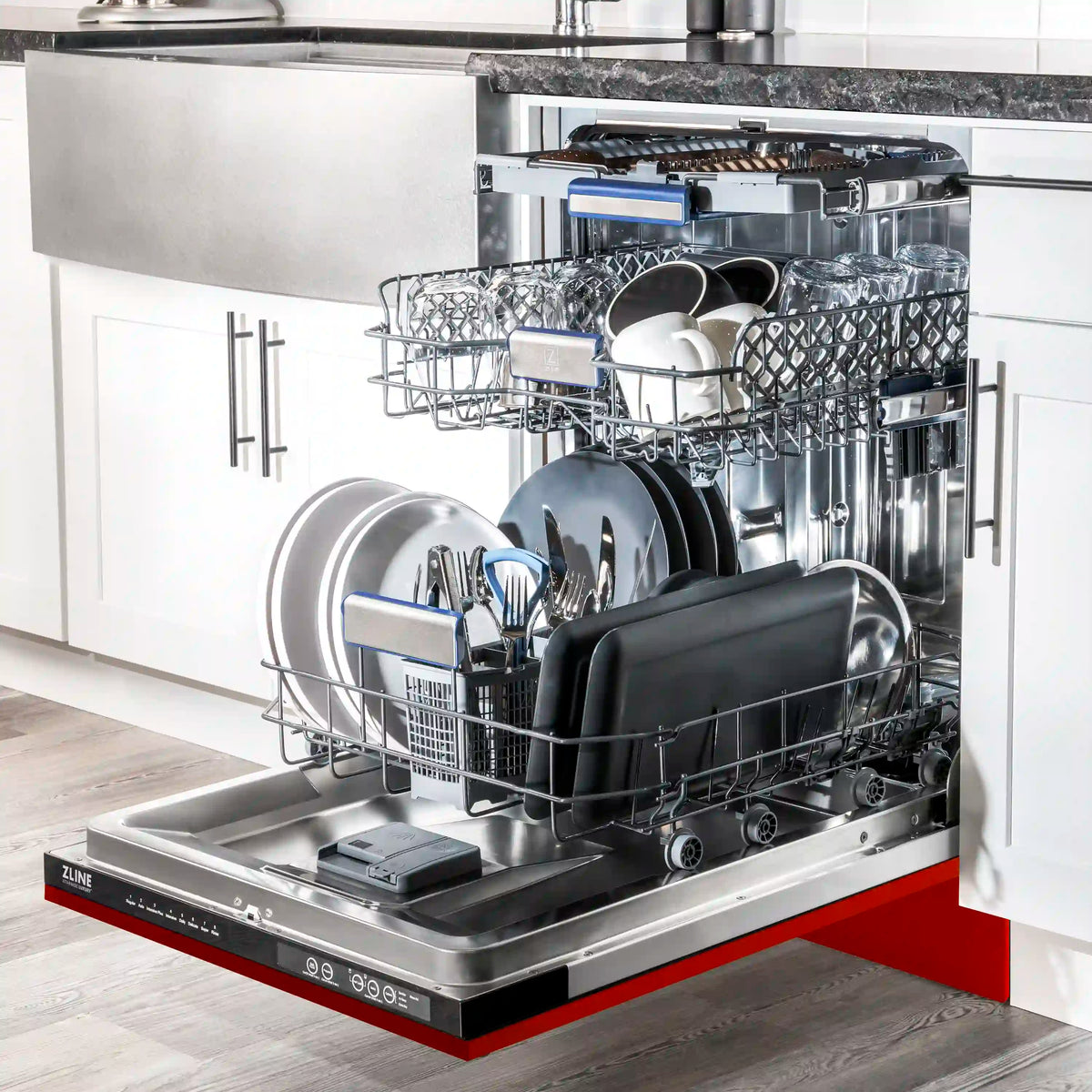 Dishwasher interior with loaded dishes and stainless steel base tub
