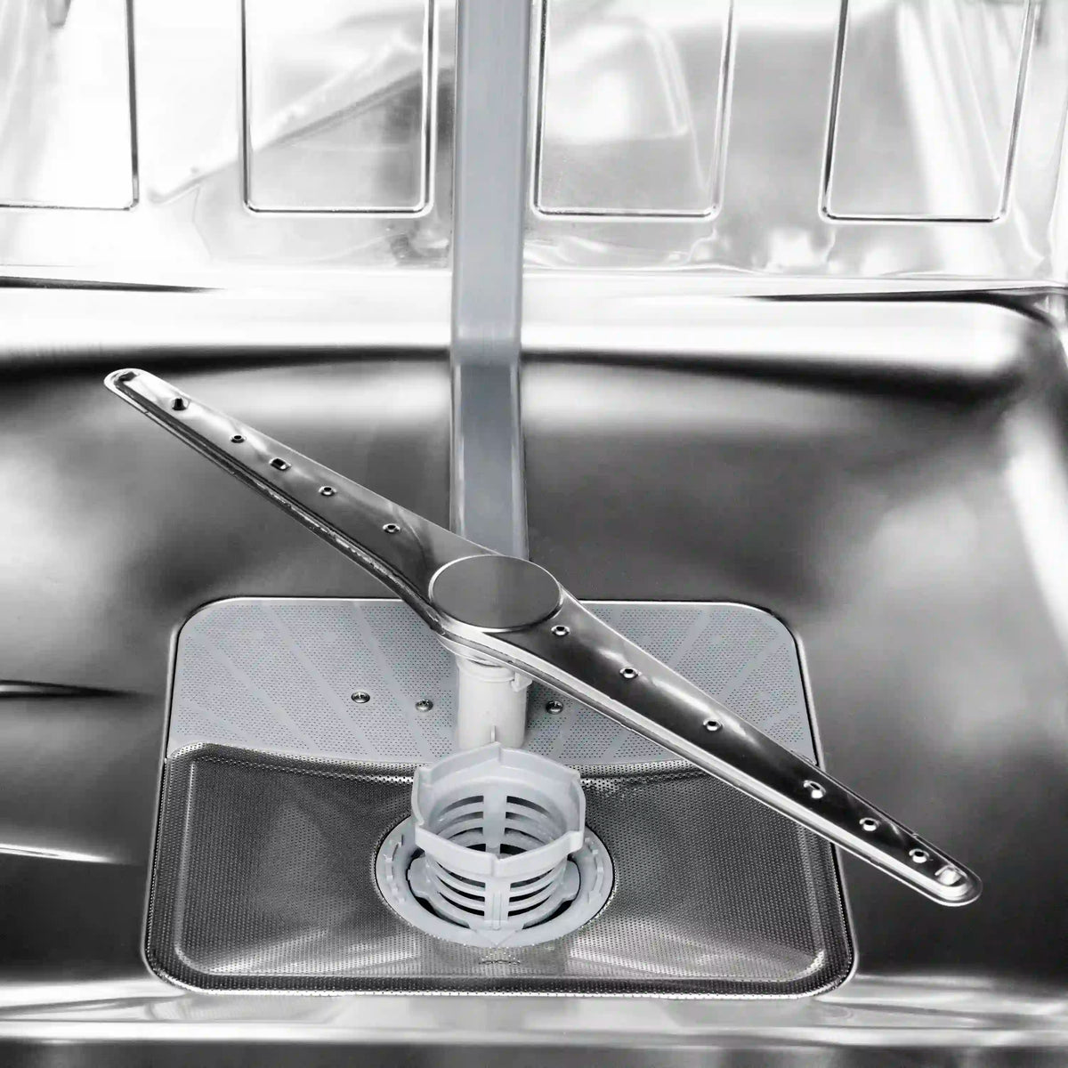 Stainless steel dishwasher tub with spray arm and drain filter area