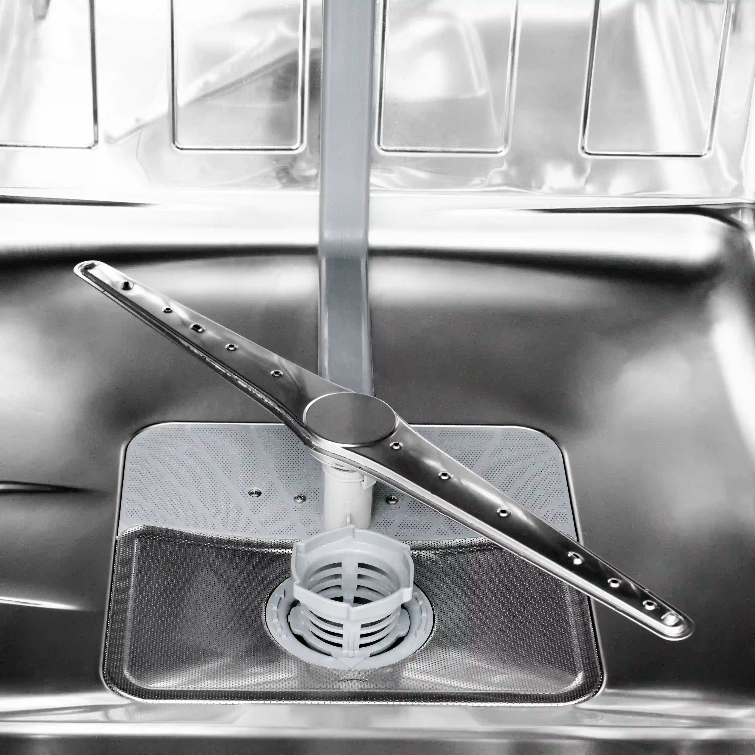 Stainless steel dishwasher tub with spray arm and drain filter area