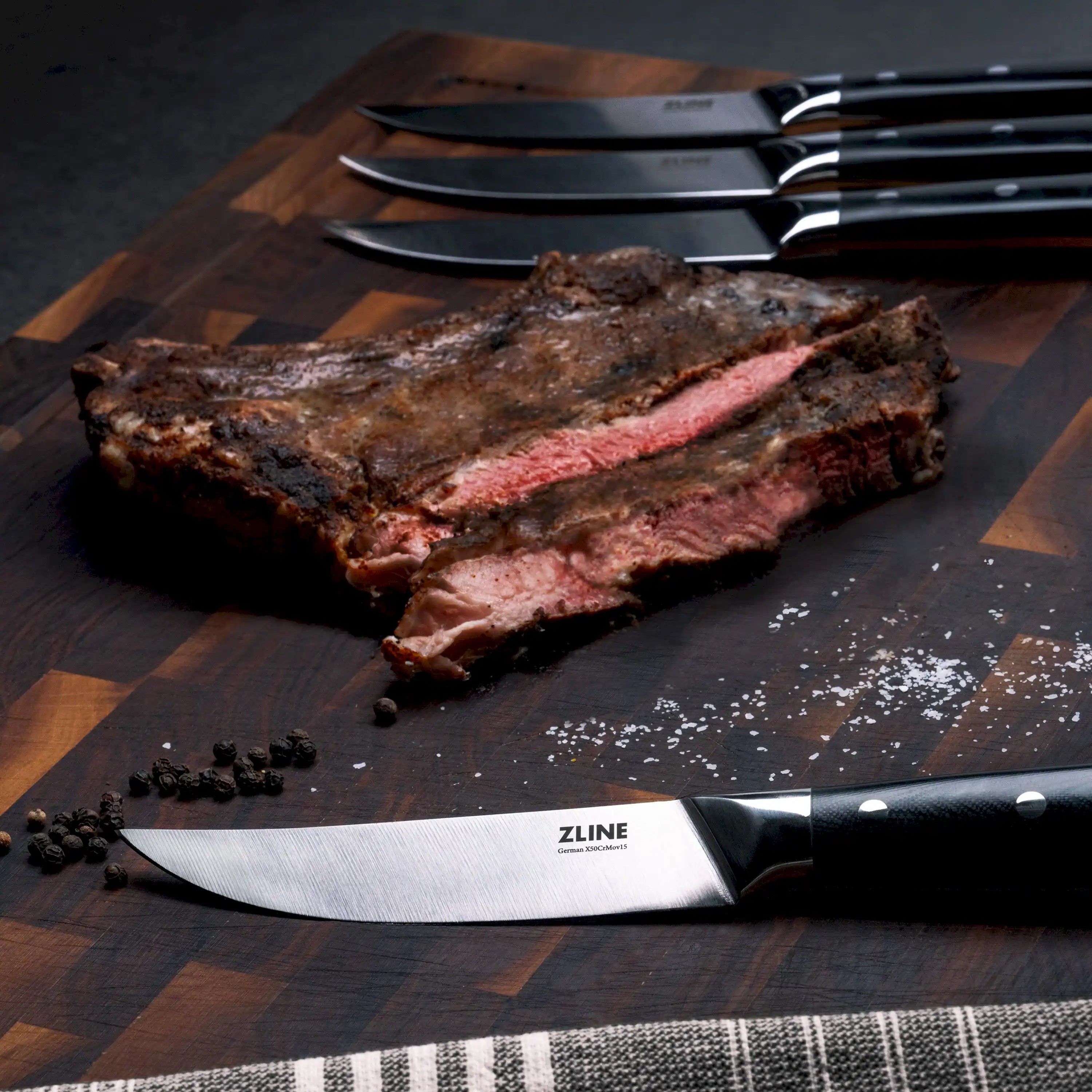 6-piece steak knife set with black dotted handles and shiny stainless blades