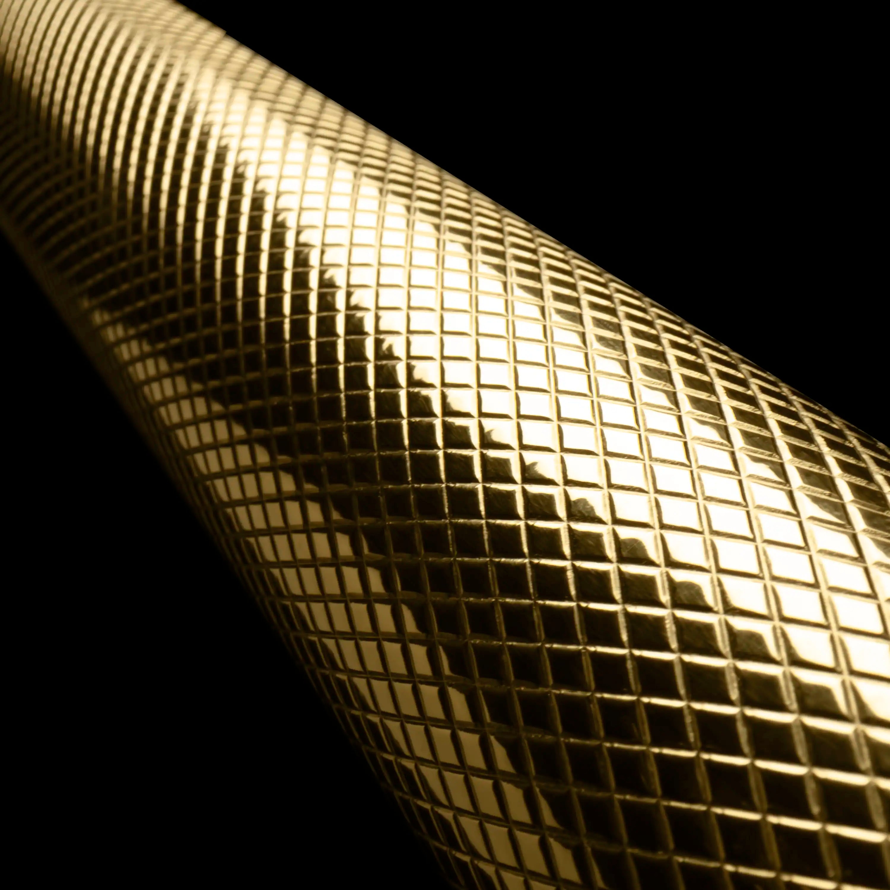 Polished gold mesh helix handle texture with fine grid pattern