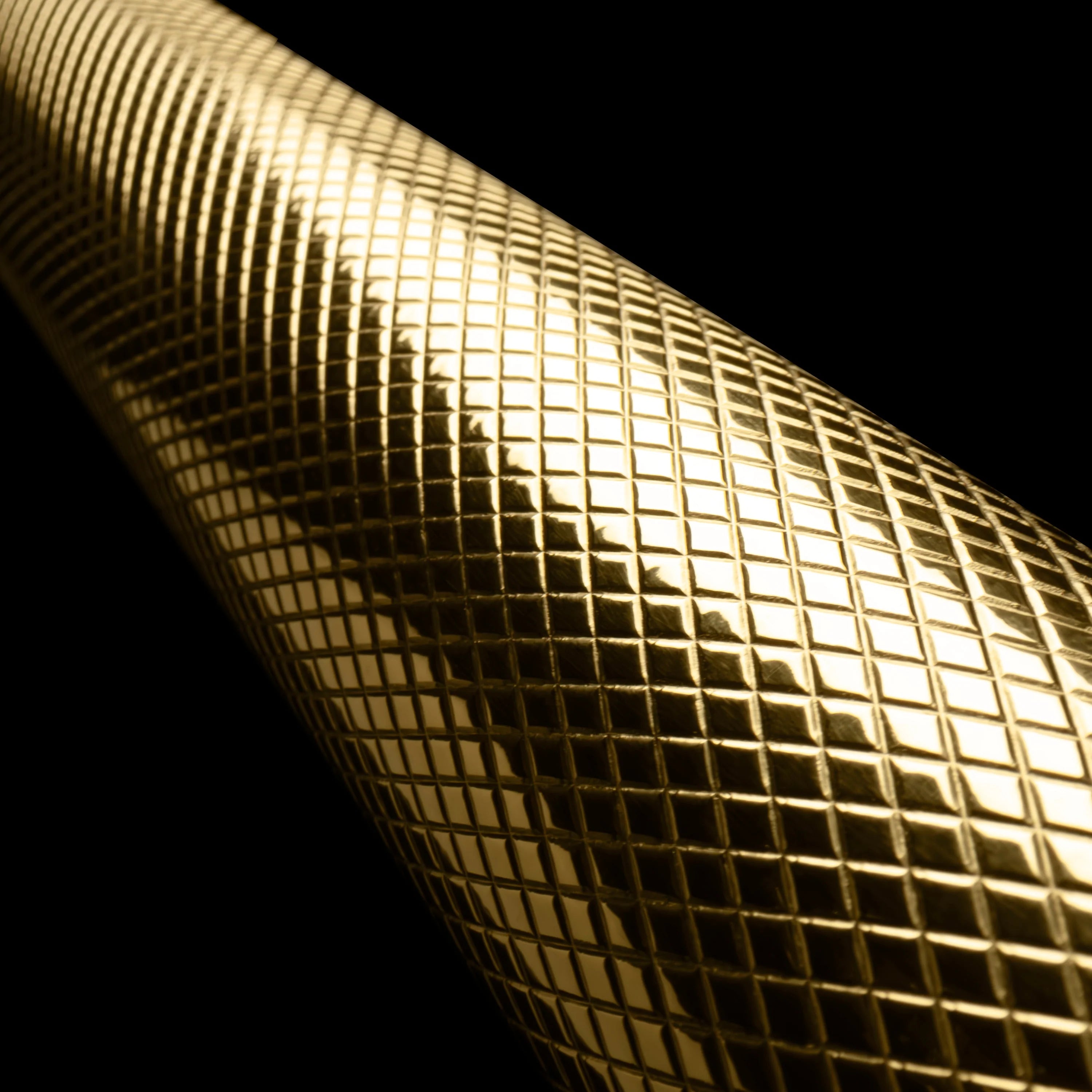 Polished gold helix handle finish with reflective grid texture