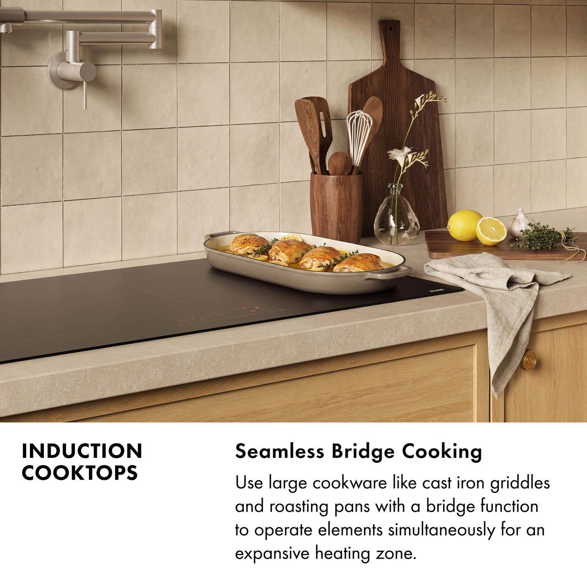 Matte black induction cooktop with cookware on the surface in a kitchen setting
