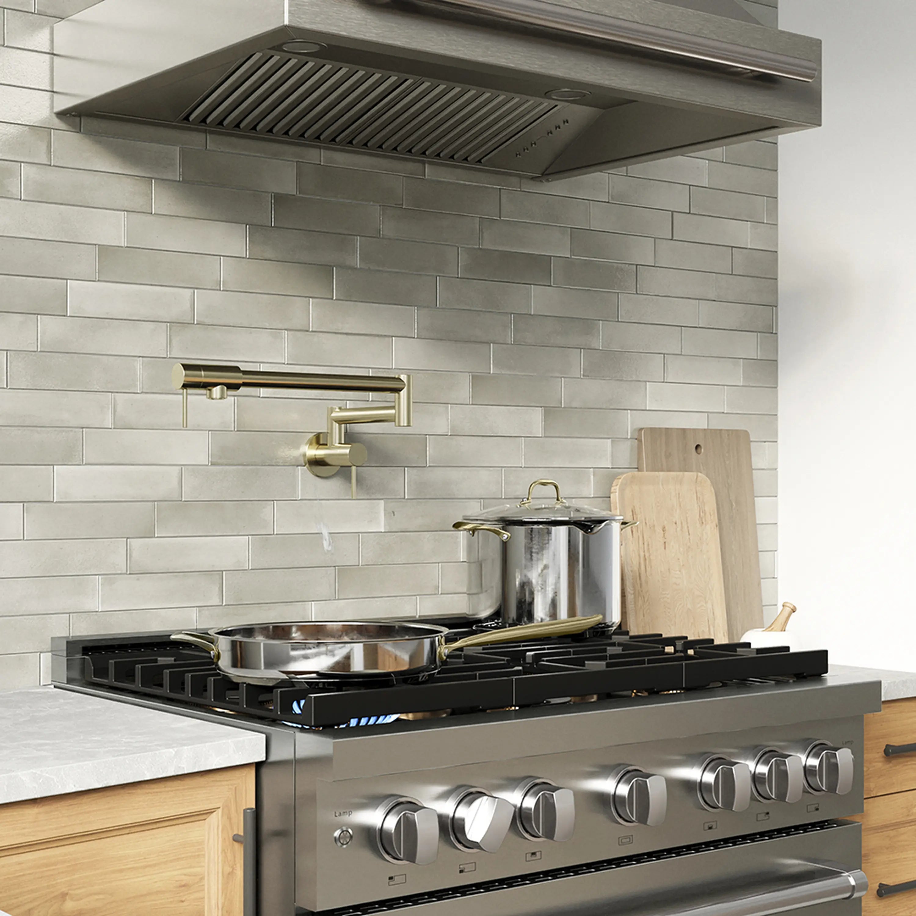Stainless gas range with overhead vent hood and four black burners
