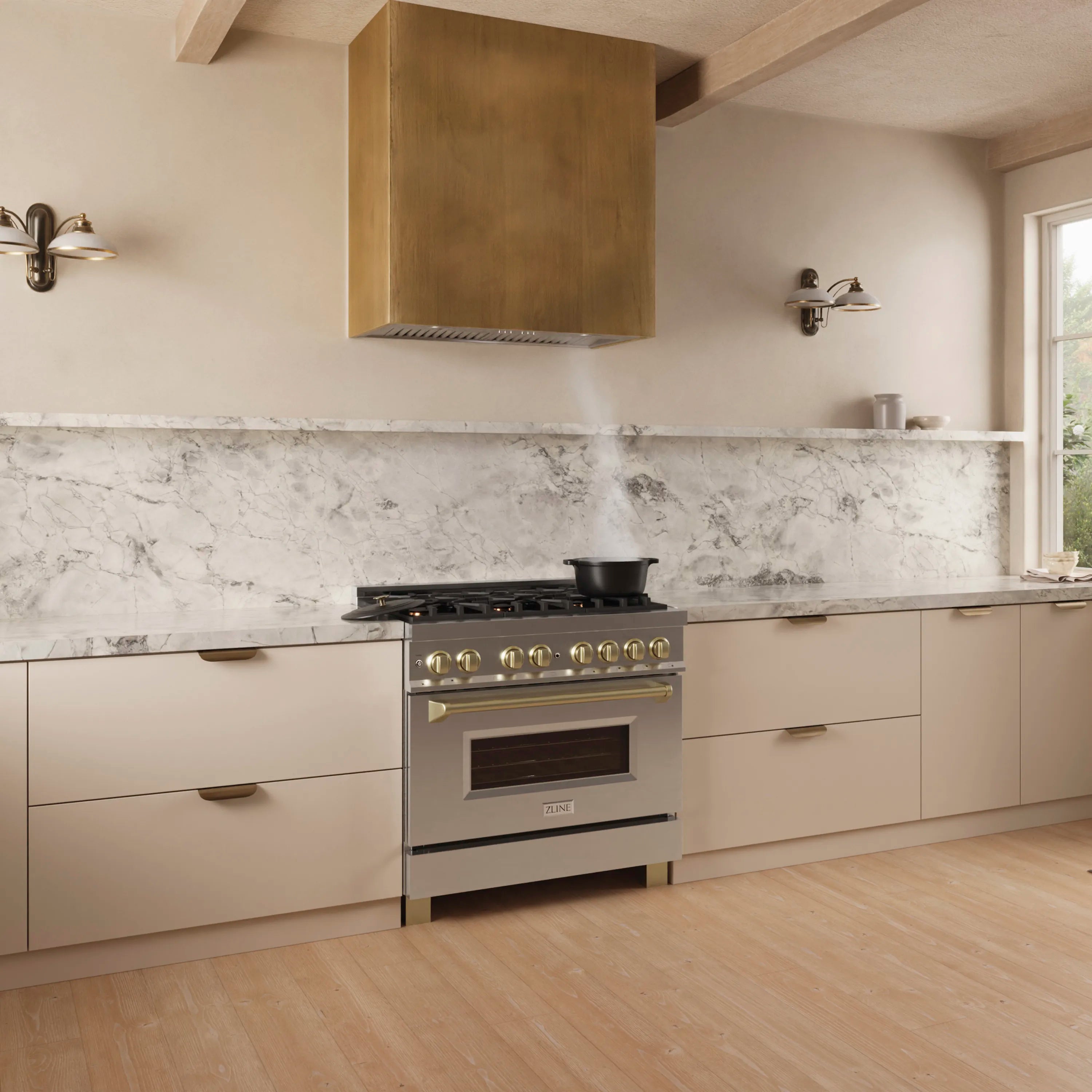 Stainless steel range hood insert centered above stovetop in modern kitchen