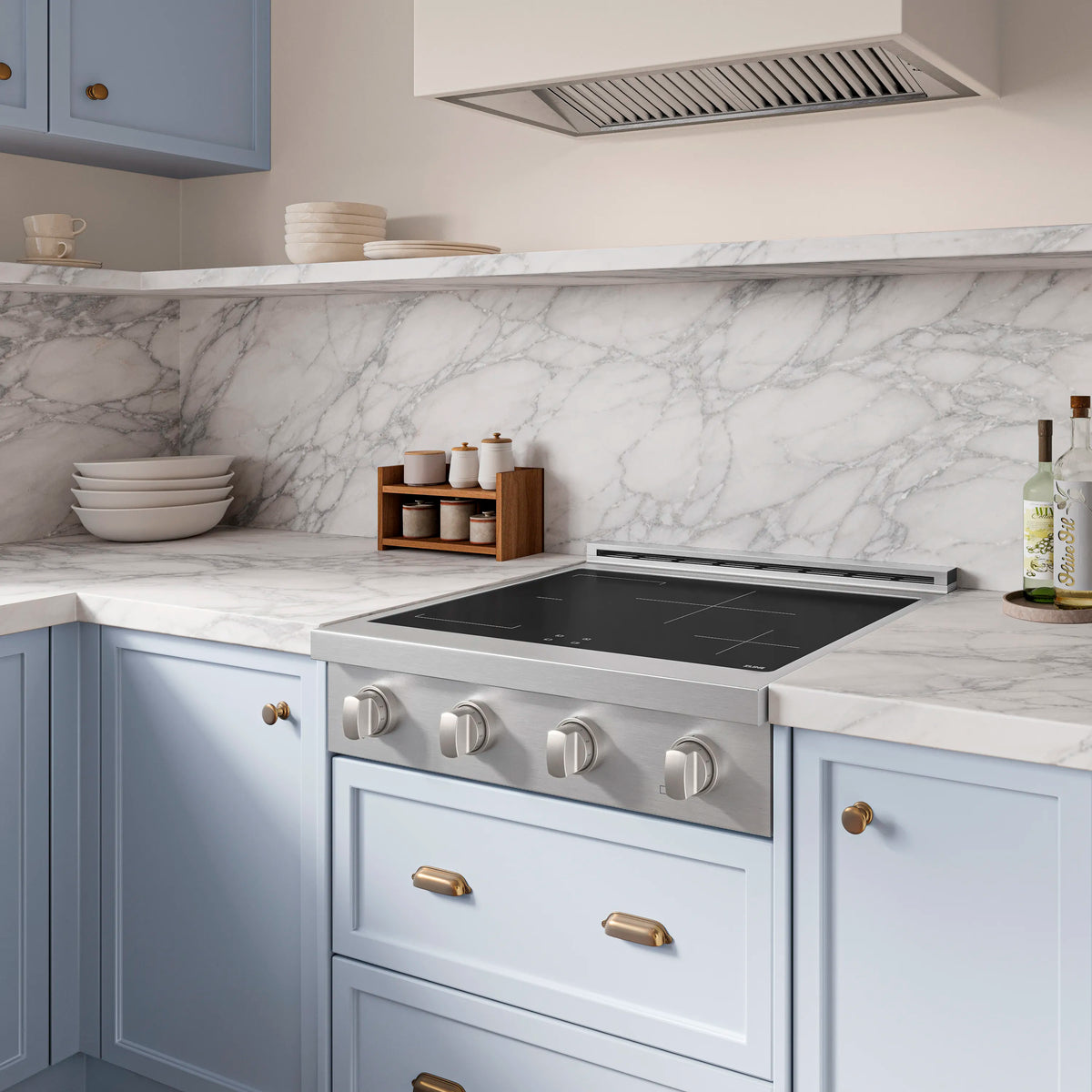 Stainless steel induction rangetop with black glass cooktop and four cooking controls