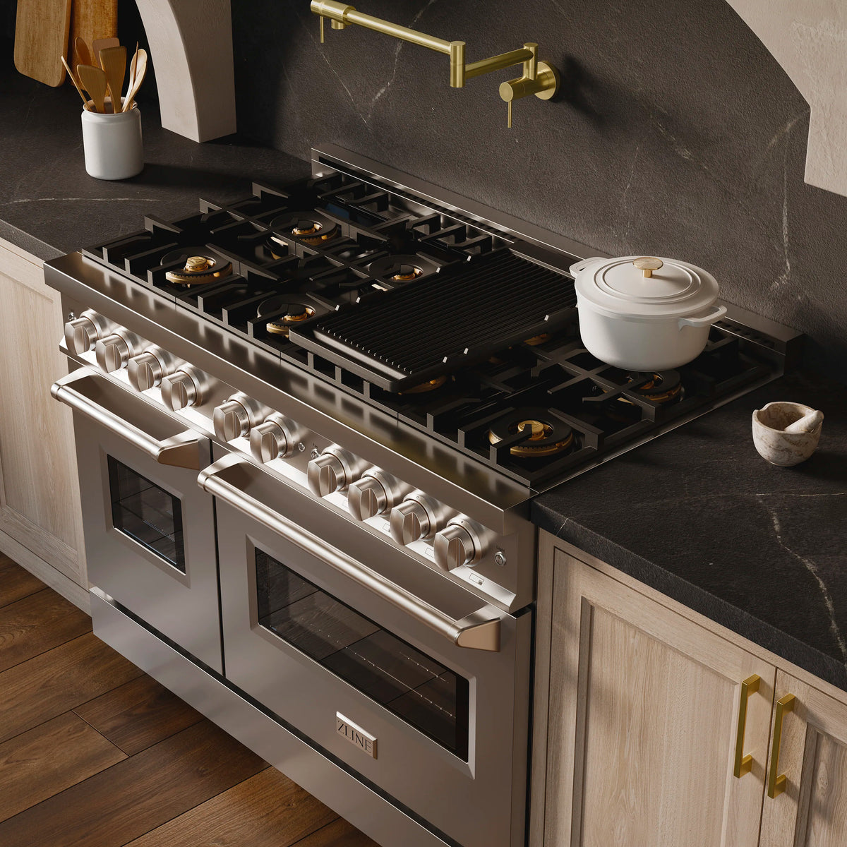 Stainless gas range with multiple burners and two oven doors, angled view.