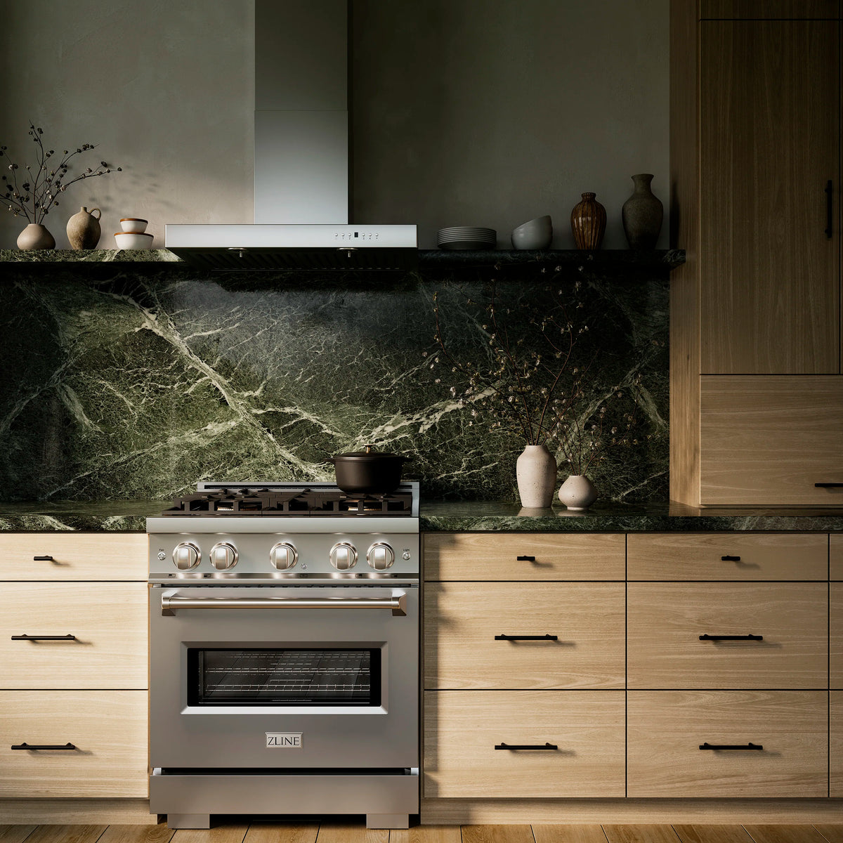 ZLINE stainless gas range with four burners and oven, centered in modern kitchen