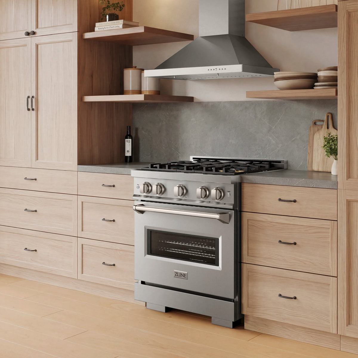 Stainless steel dual fuel range with four gas burners and electric convection oven door
