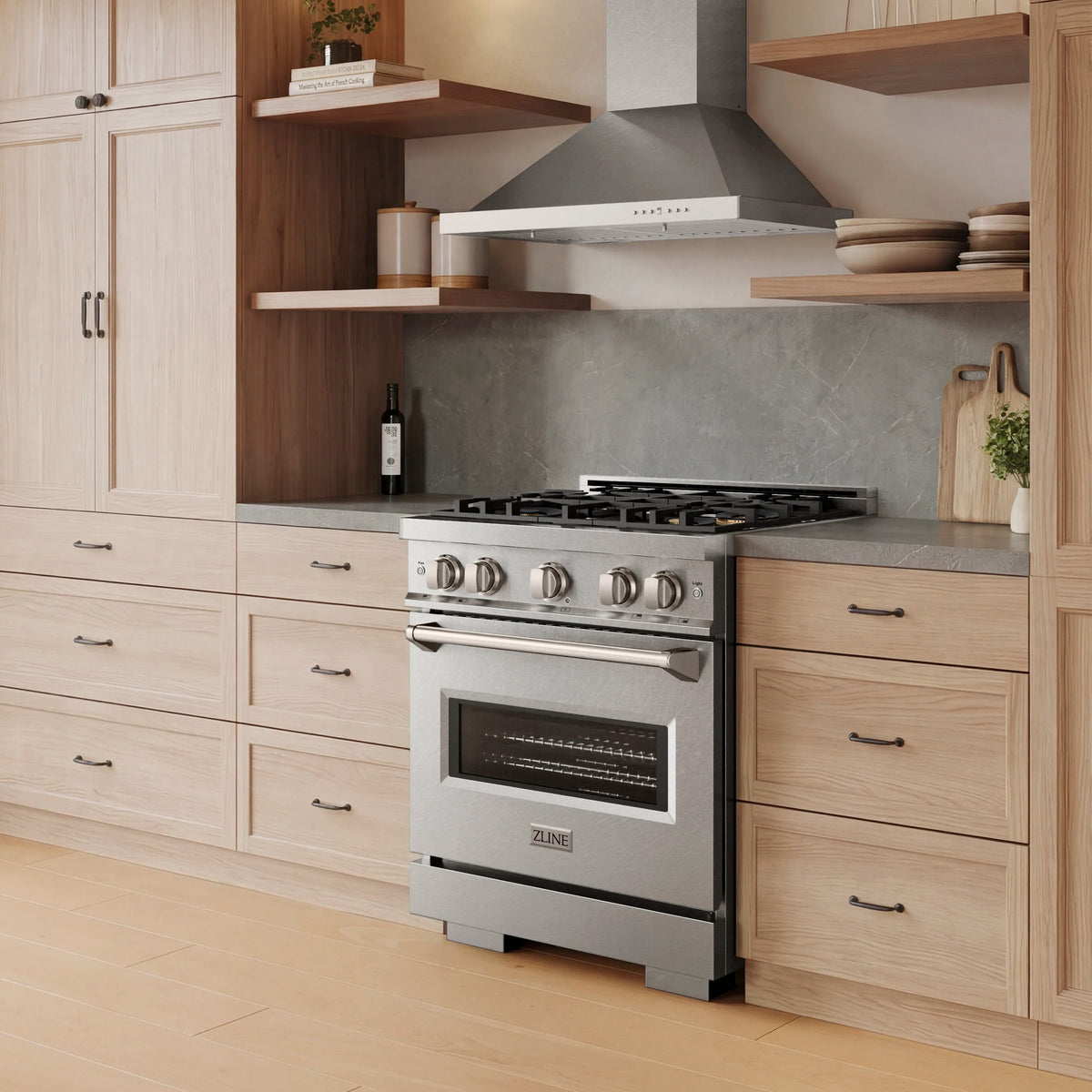 Satin stainless freestanding dual fuel range with oven door and control knobs