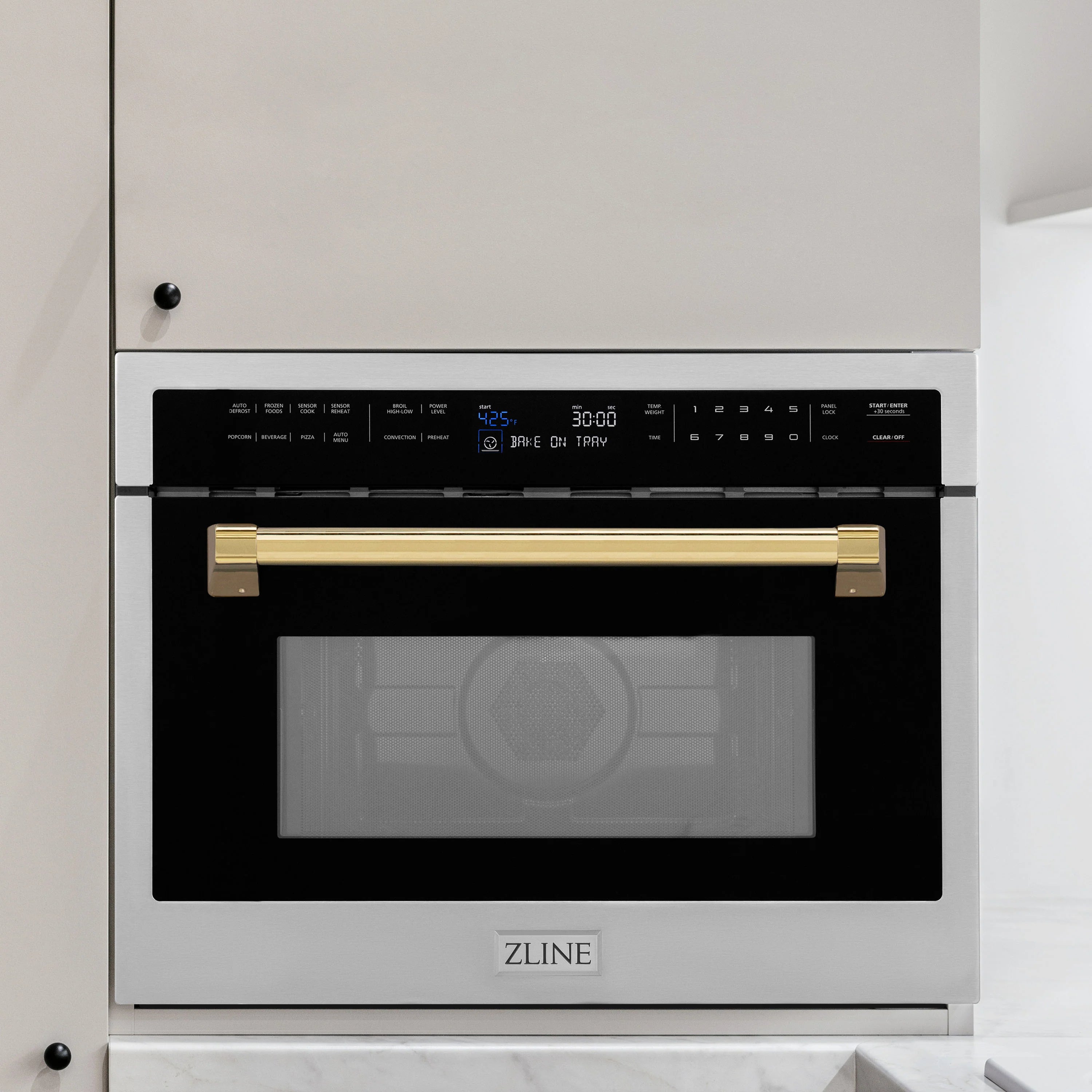 Built-in convection microwave oven with closed door, gold front trim and ZLINE logo