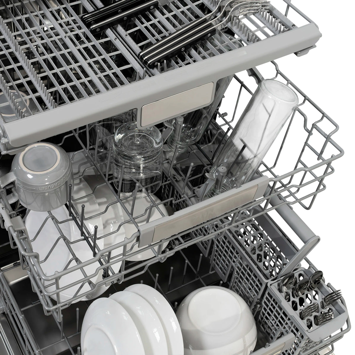 Close-up of dishwasher interior rack holding cups, plates, and glasses